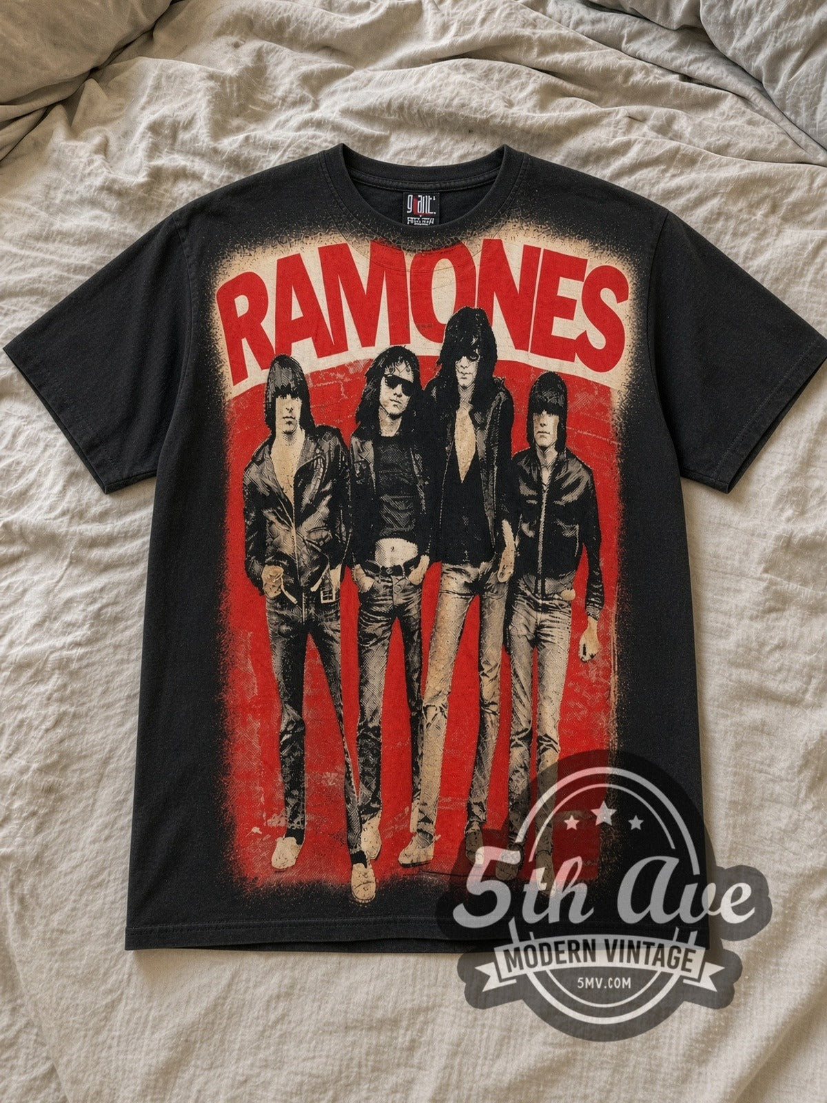 Black The Ramones All Over Print Vintage Band T-Shirt laid flat on a linen bed