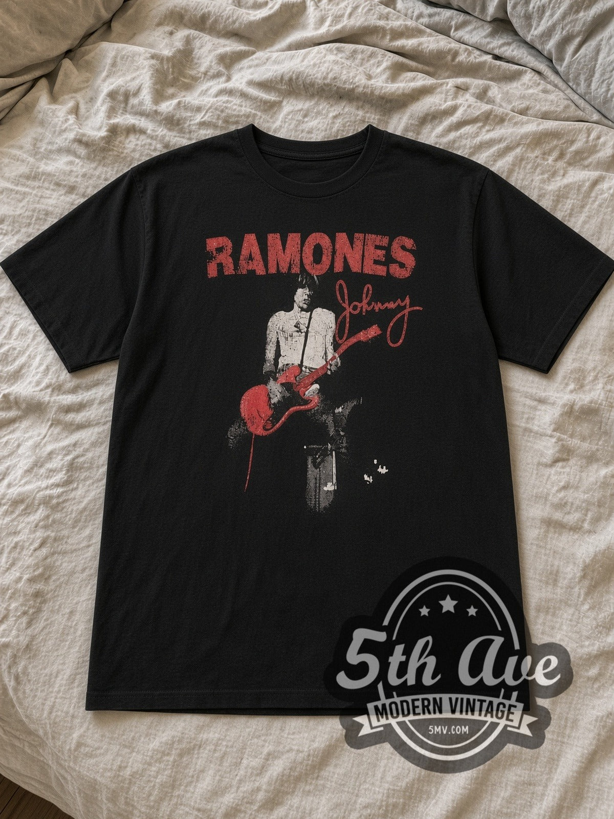 Black The Ramones Graphic Vintage Band T-Shirt laid flat on a linen bed