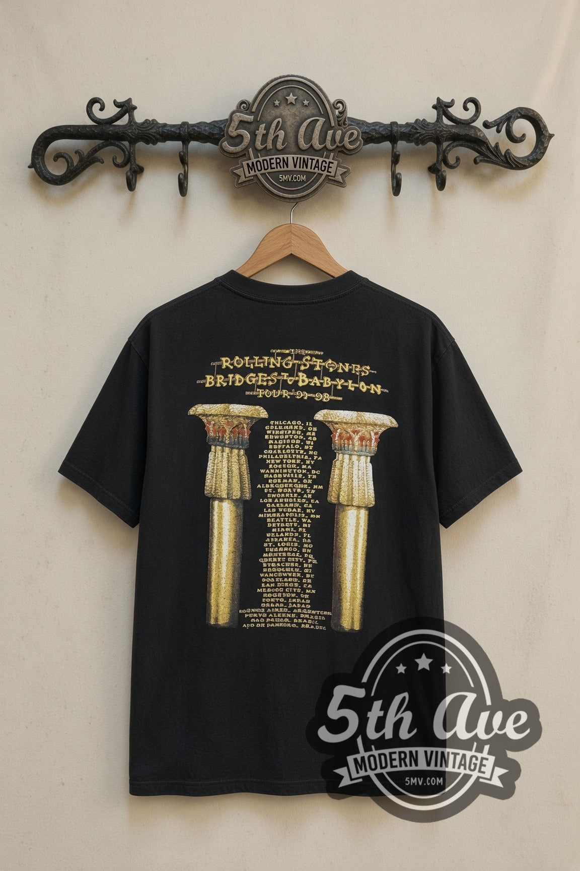 The Rolling Stones Bridges to Babylon Gold Tongue band t-shirt in black, back view on a display rack