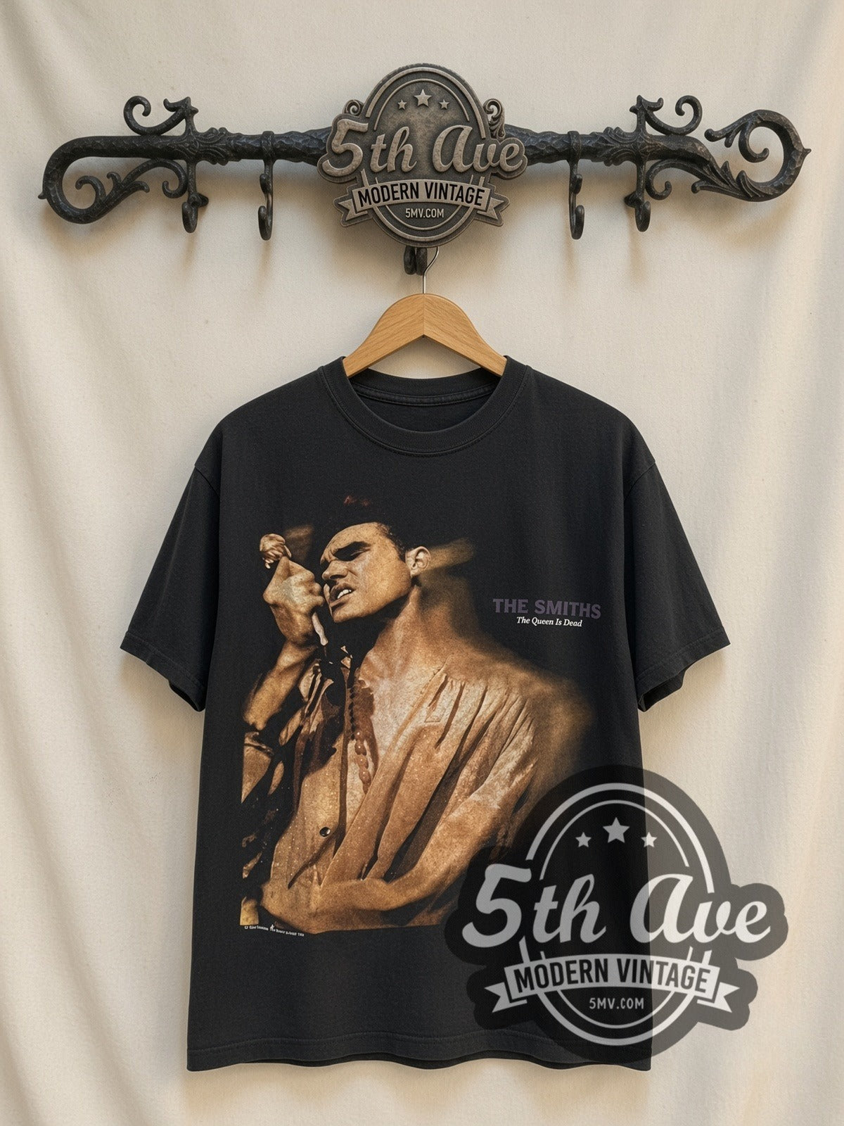 The Smiths The Queen Is Dead UK Tour 86 vintage band t-shirt, front view on a display rack