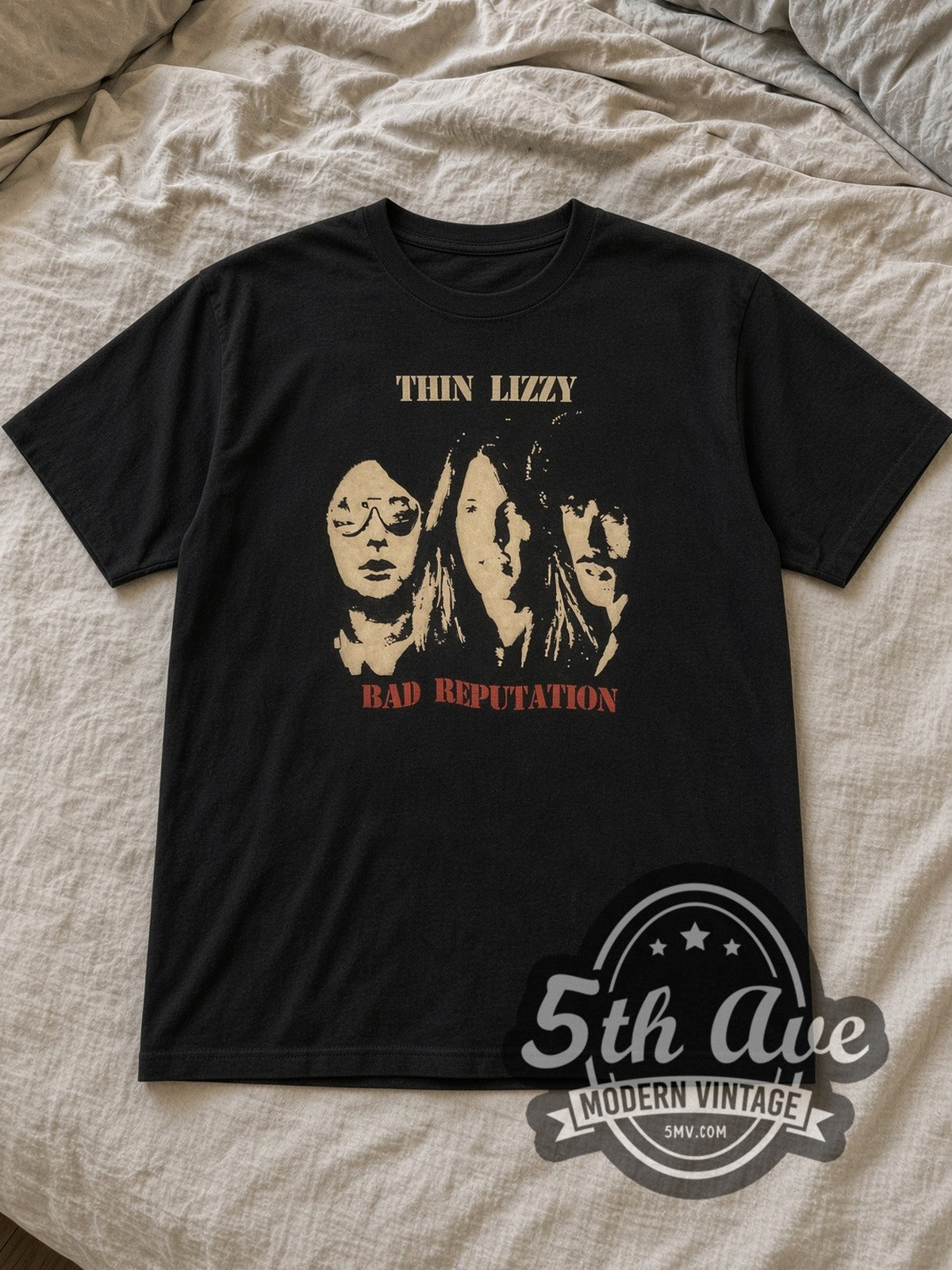 Black Thin Lizzy Bad Reputation Album Cover Vintage Band T-Shirt laid flat on a linen bed