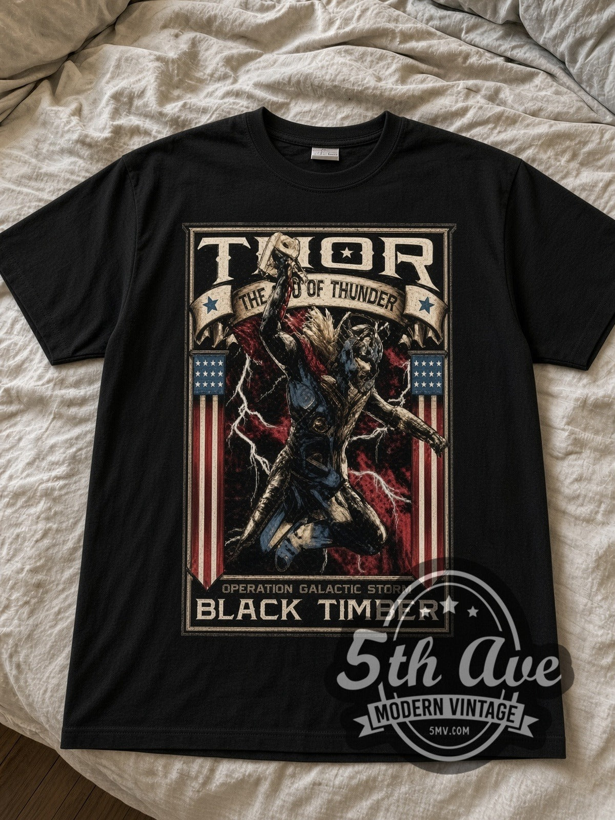 Thor God of Thunder Operation Galactic Storm Frame black graphic tee laid flat on linen bed