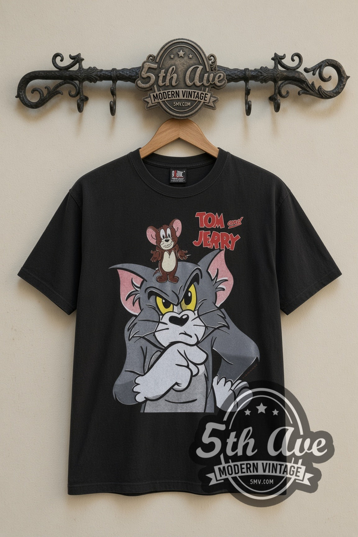 Tom and Jerry Angry Tom with Jerry cartoon tee in black, front view on a display rack