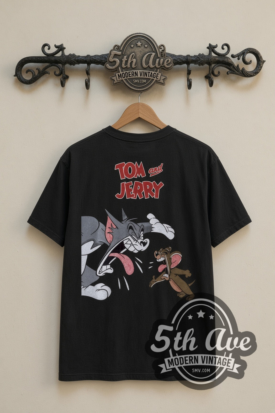 Tom and Jerry Angry Tom with Jerry cartoon tee in black, back view on a display rack