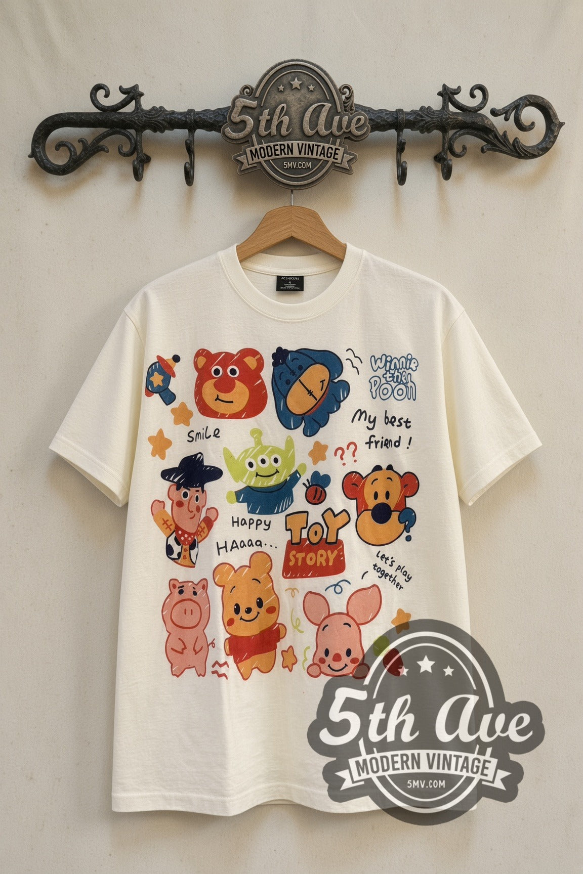 Toy Story & Winnie the Pooh Best Friends Sticker Collage cartoon tee front on 5th Ave iron rack