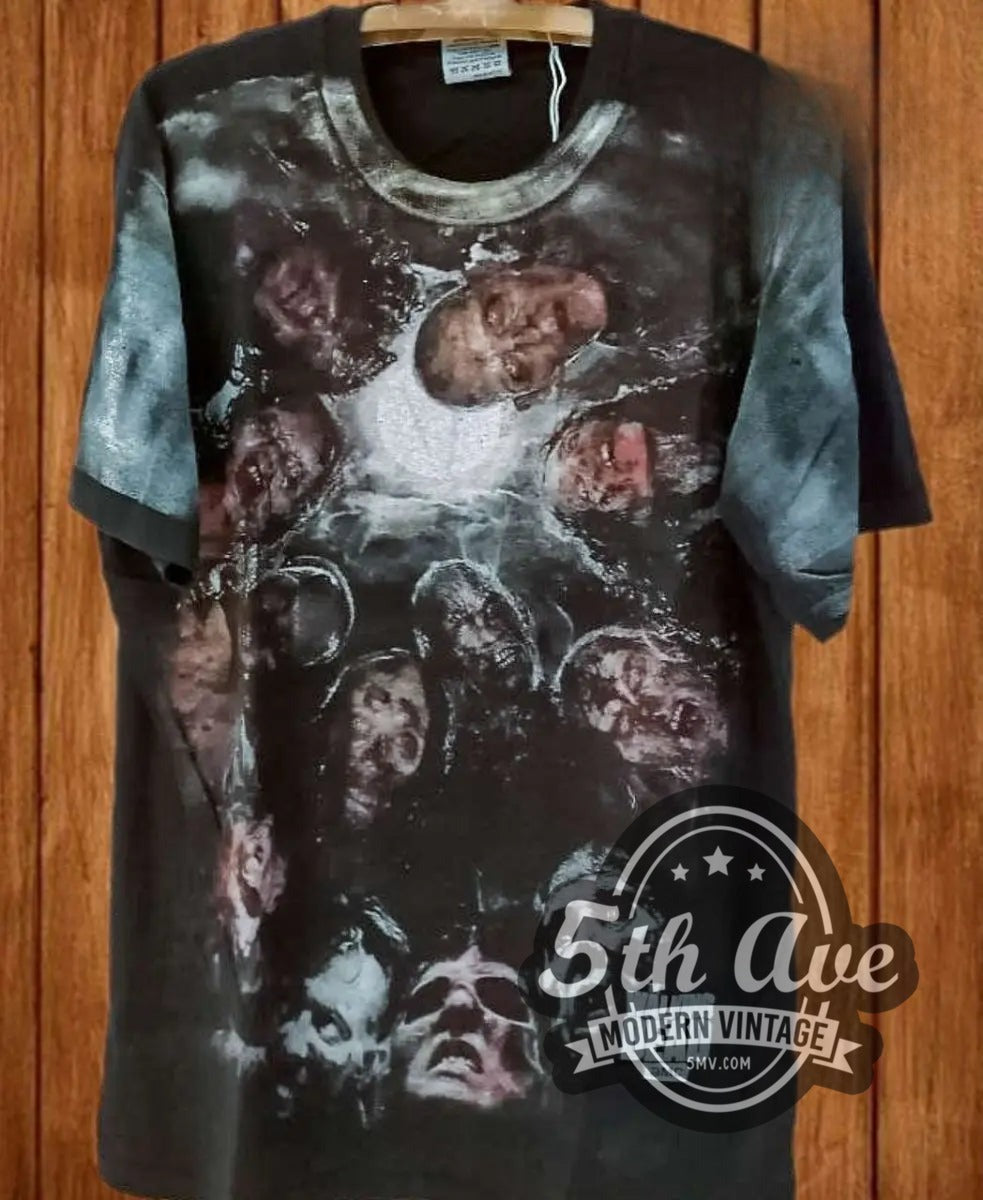 The Walking Dead Zombie Horde all-over-print vintage movie tee, front view on a display rack
