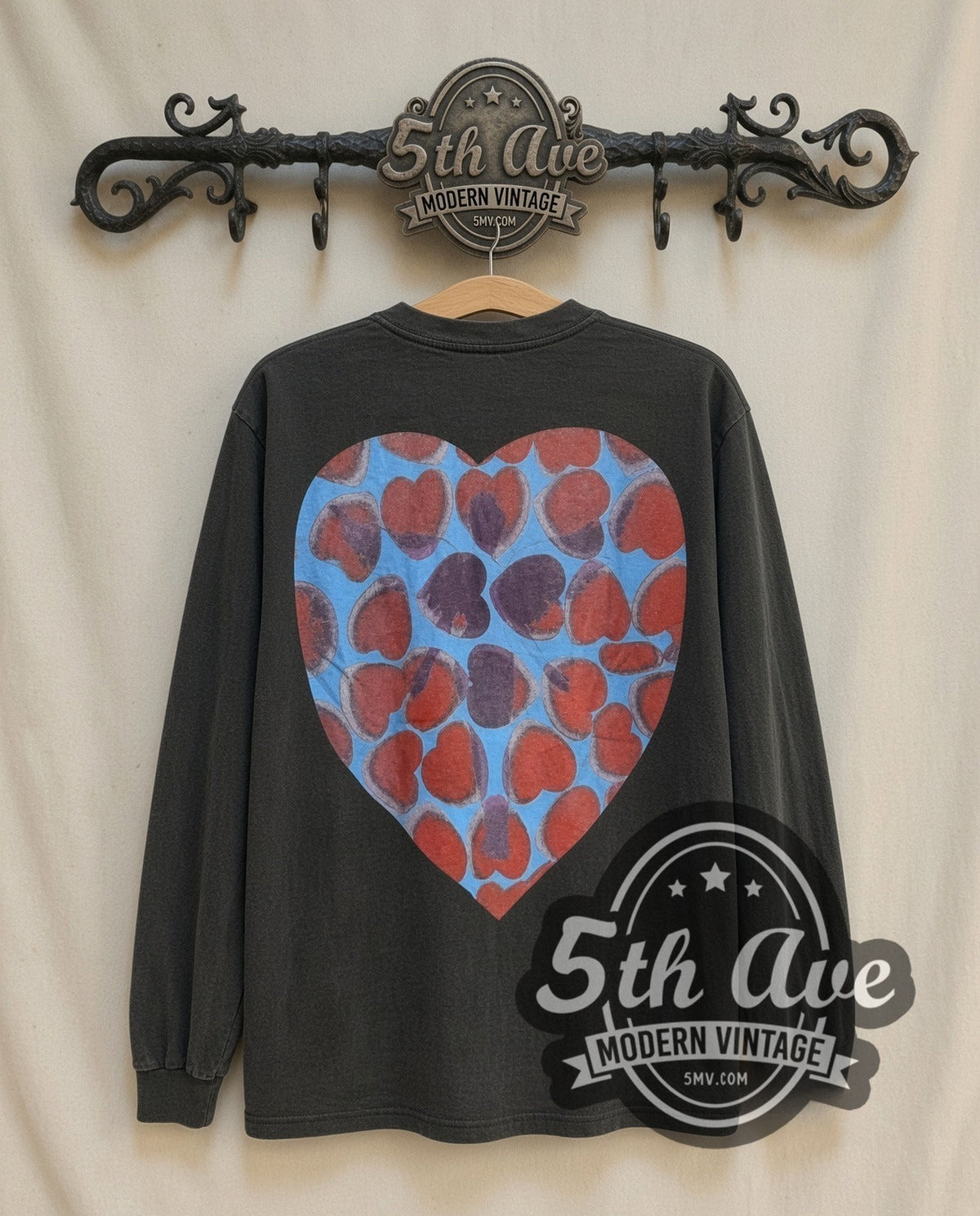 Nirvana Heart-Shaped Box long sleeve vintage band t-shirt, back view on a display rack