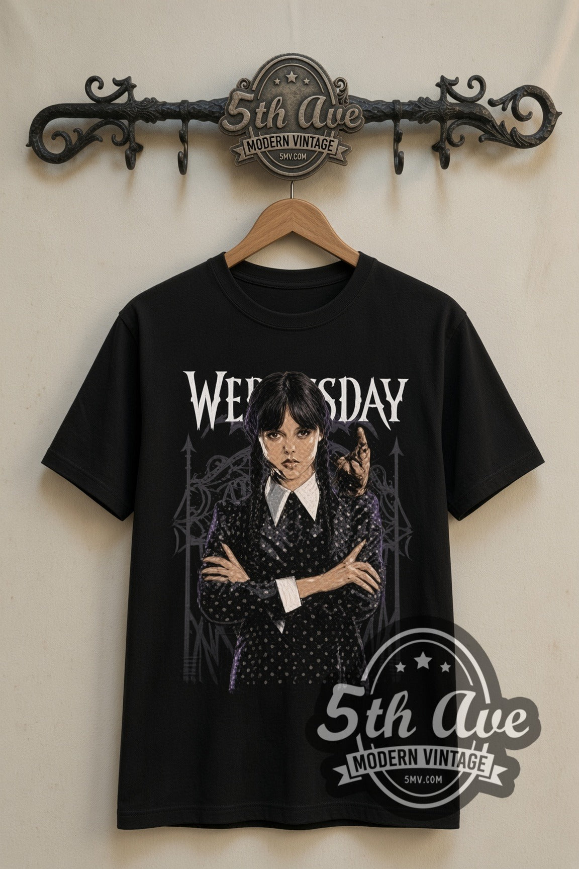 Wednesday Addams with Thing double stitched black tee front on dark iron 5th Ave rack