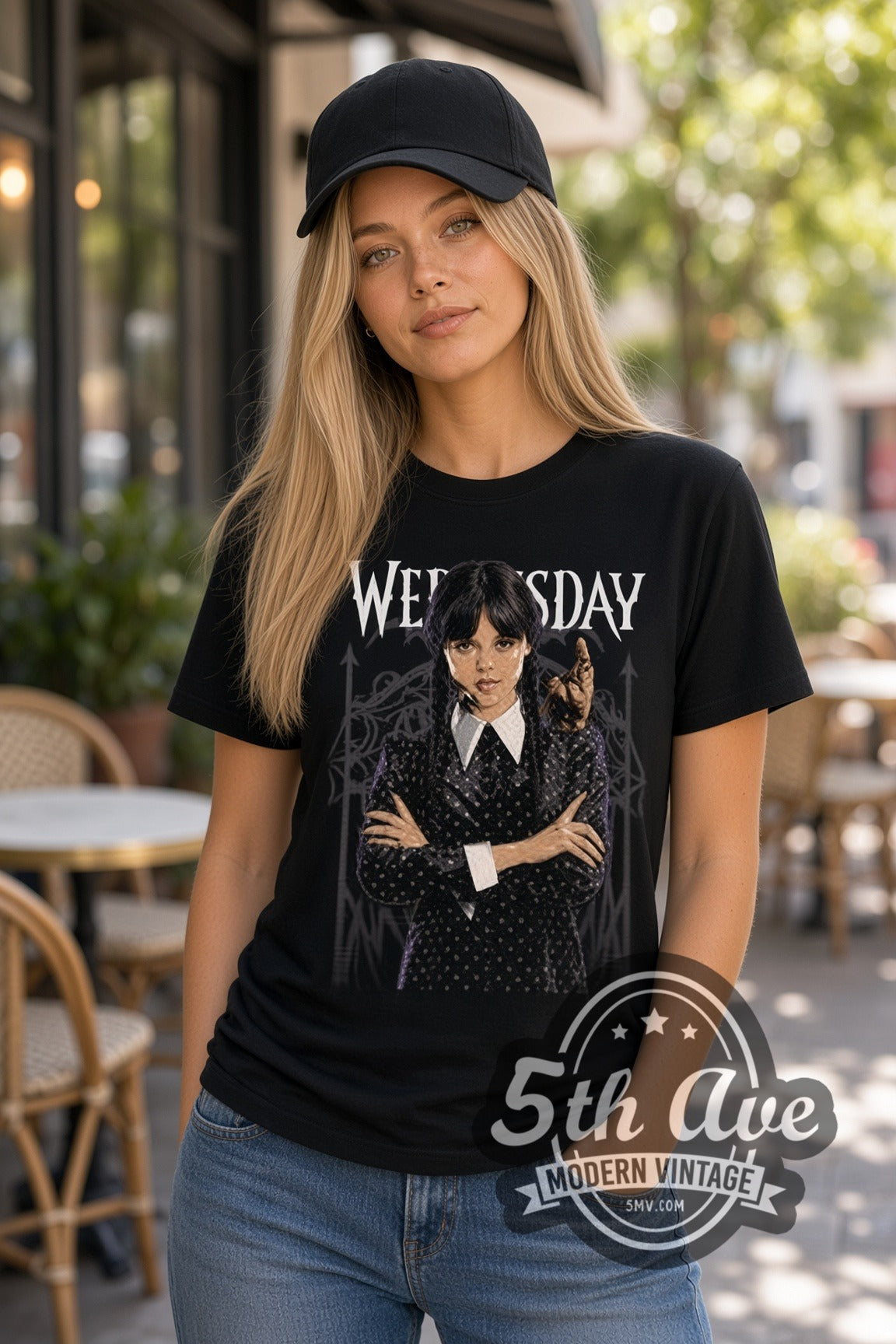 Woman wearing Wednesday Addams with Thing double stitched black graphic tee