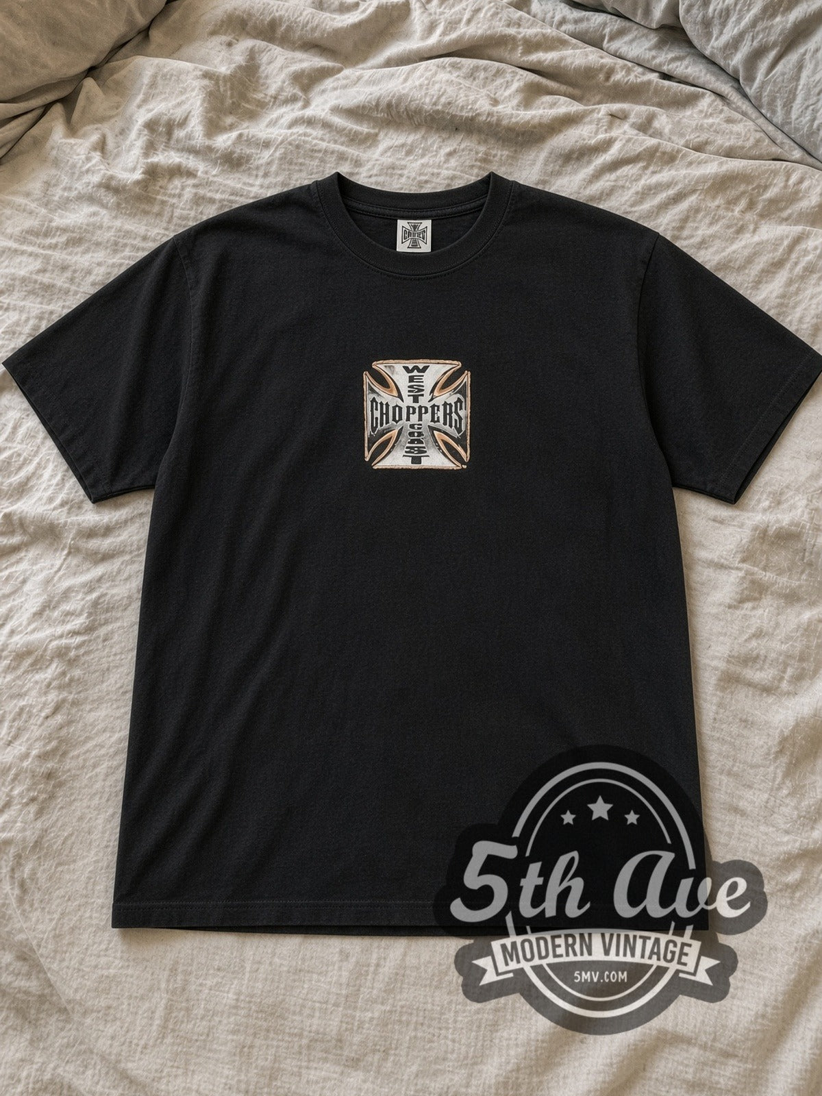 Black West Coast Choppers Long Beach Orange Chopper Iron Cross Vintage Biker T-Shirt laid flat on a linen bed