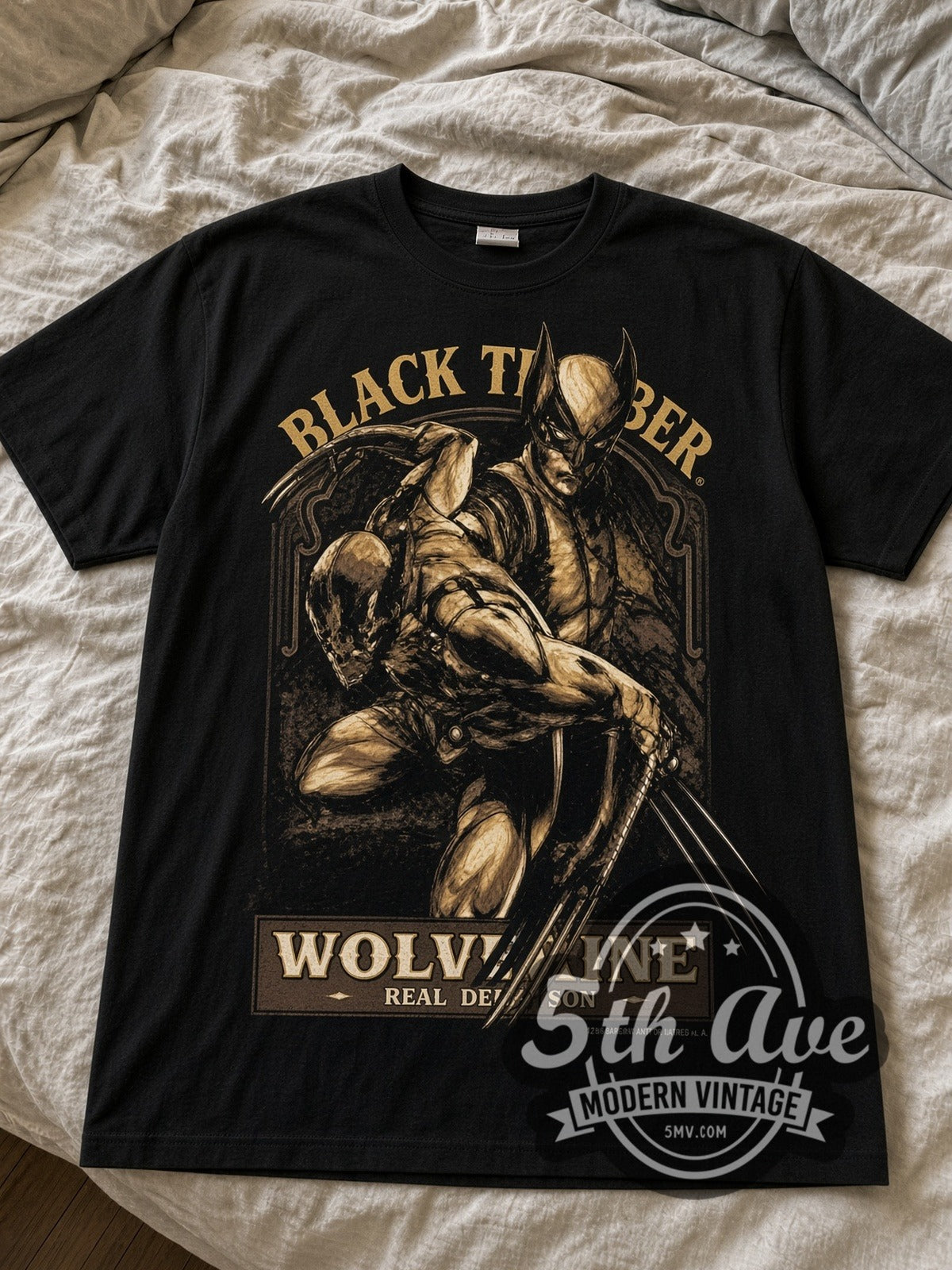Wolverine Black Timber Claws black graphic tee laid flat on linen bed