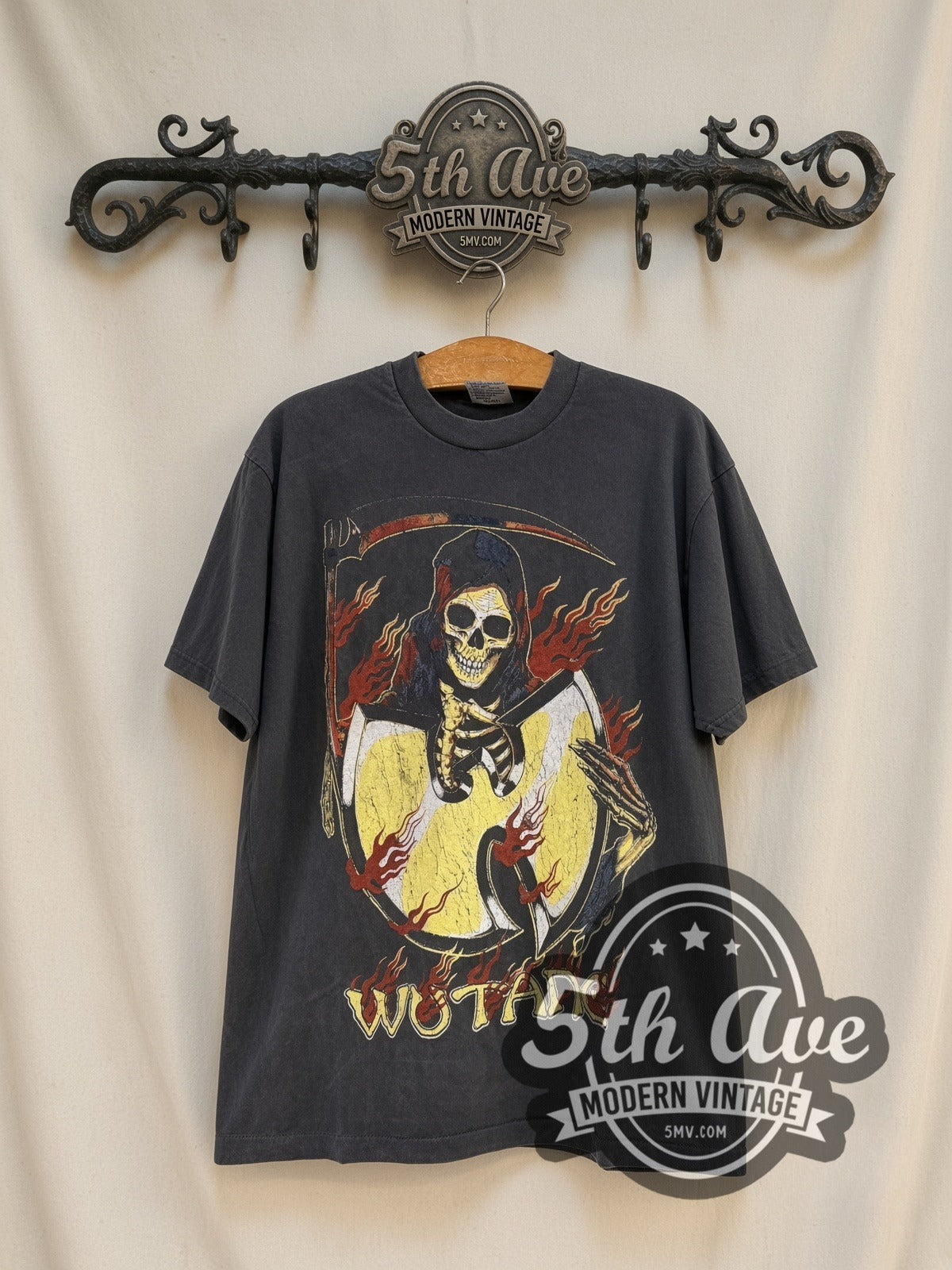 Wu-Tang Clan C.R.E.A.M. Reaper vintage rap tee, front view on a display rack