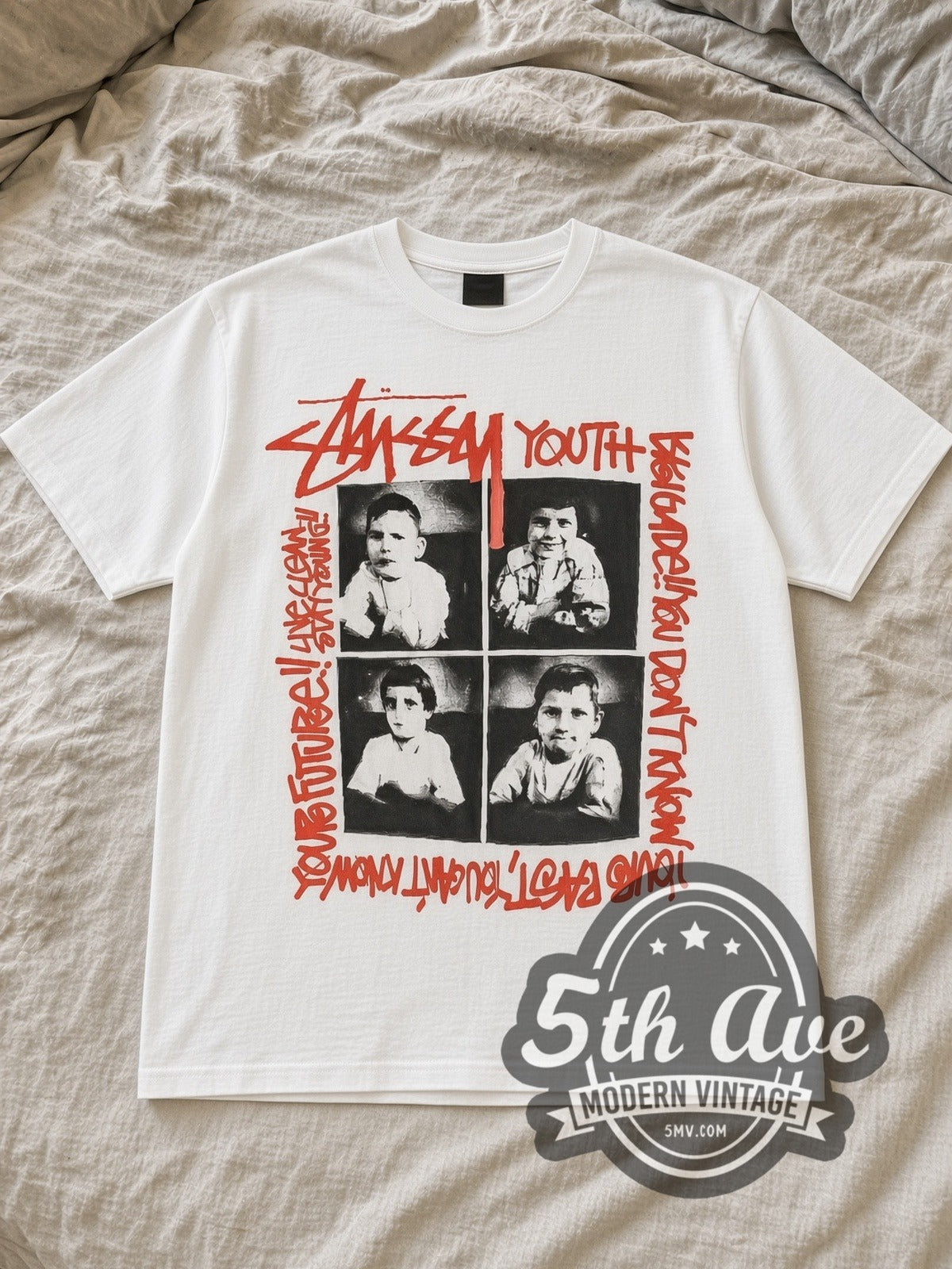 White Youth Brigade x Stüssy Live Clean Stay Young Vintage Band T-Shirt laid flat on a linen bed
