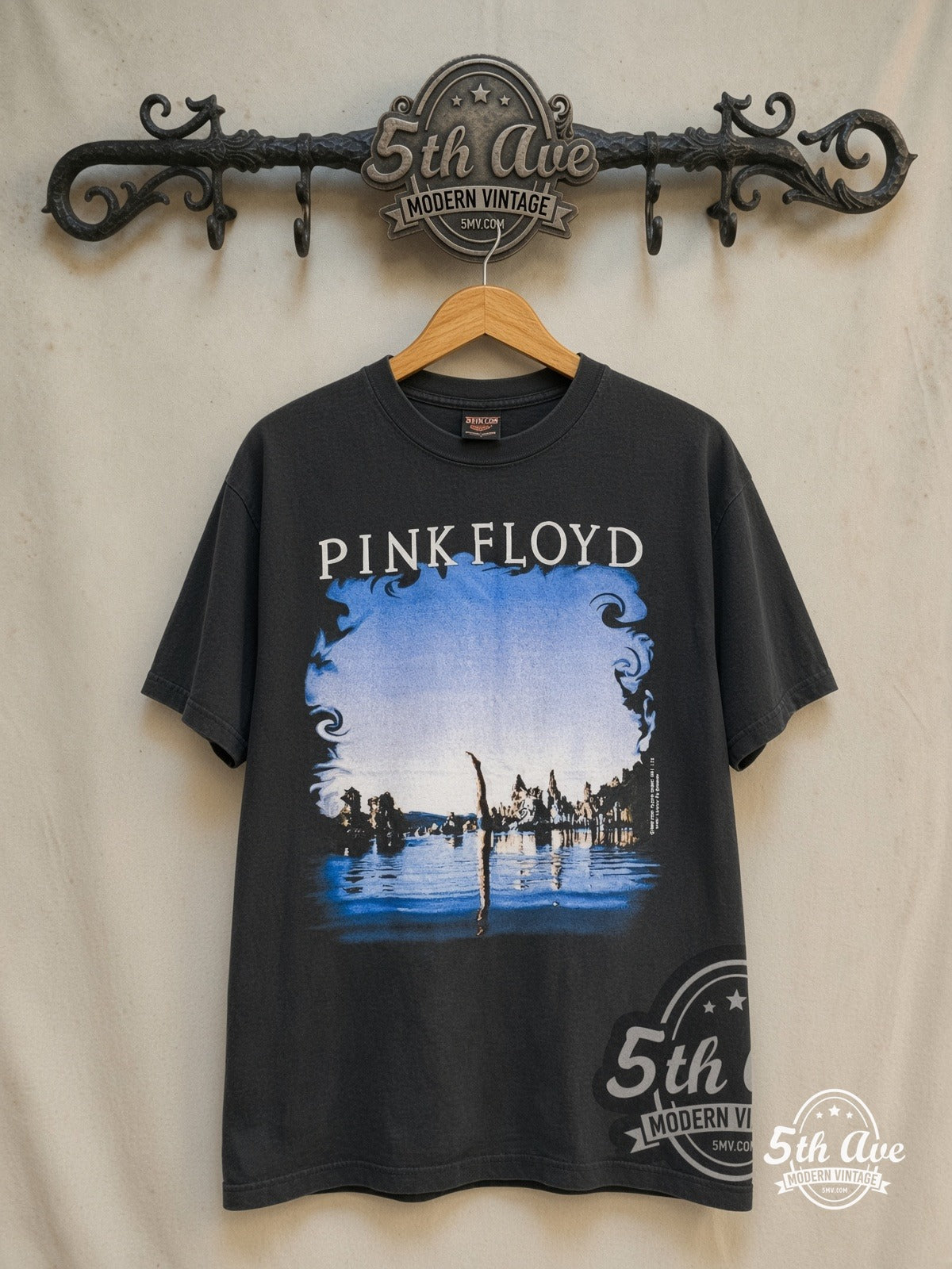 Pink Floyd Wish You Were Here 1975 vintage band t-shirt in black, front view on a display rack