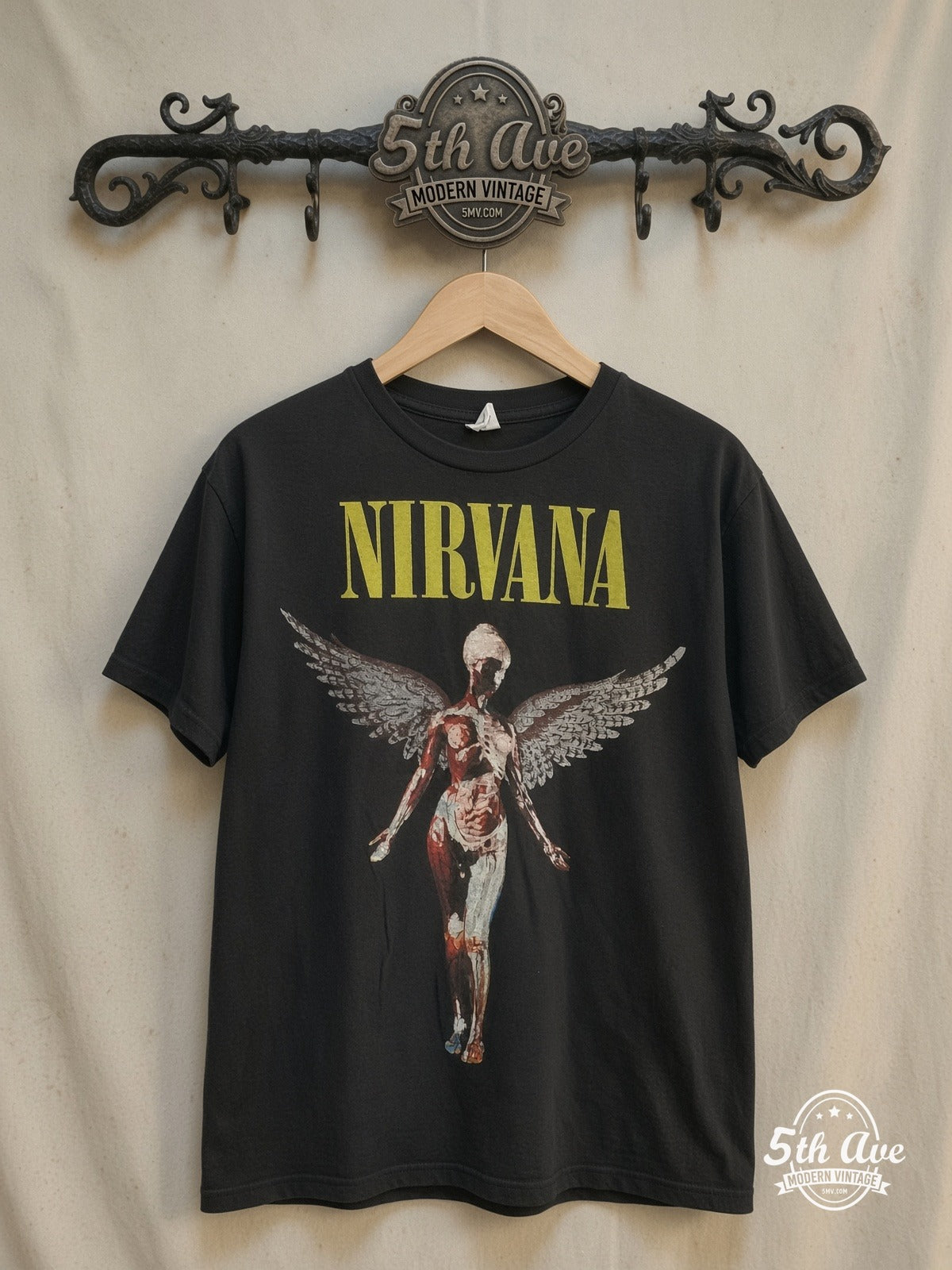 Nirvana In Utero Angel with Back Print vintage band t-shirt, front view on a display rack