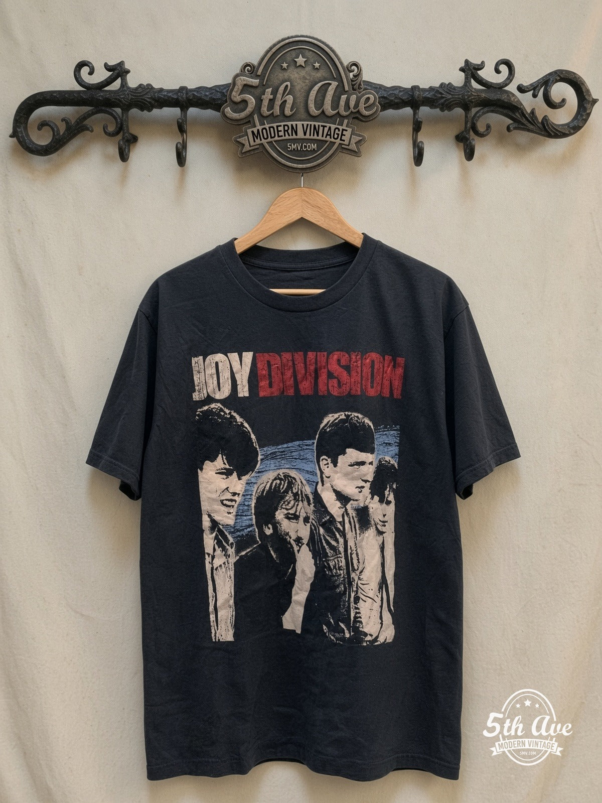 Joy Division Iconic vintage band t-shirt, front view on a display rack