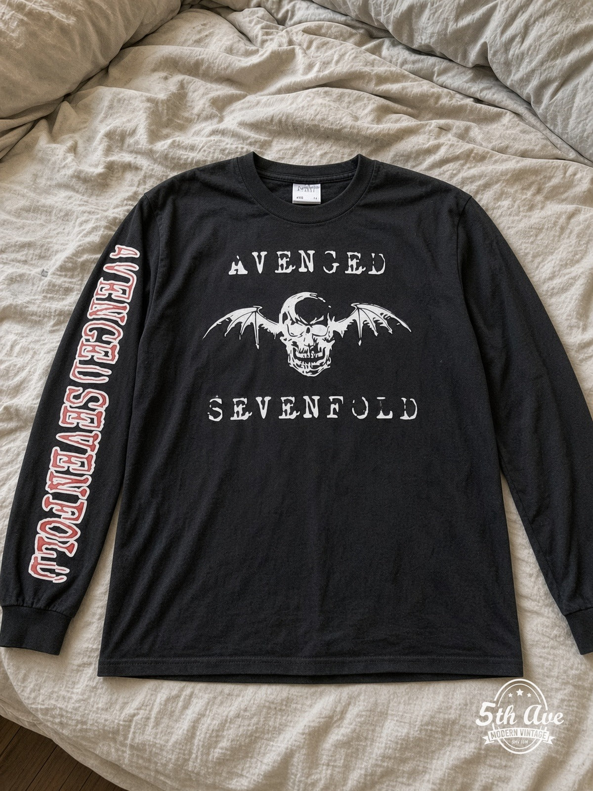 ETS LS 02 Avenged Sevenfold Deathbat Logo long sleeve vintage tee laid on a bed