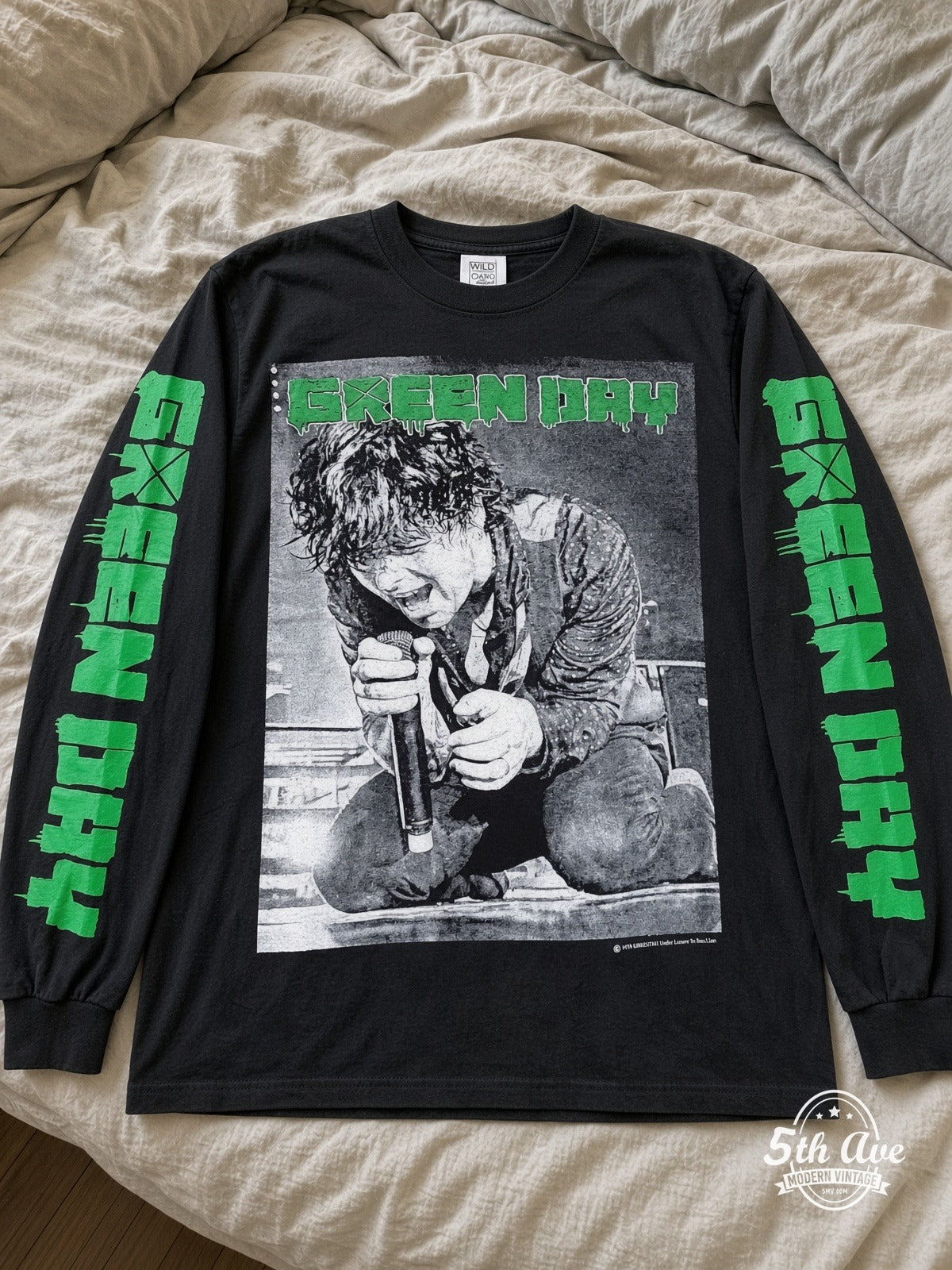 ETS LS 06 Green Day Kneeling Singer long sleeve vintage tee laid on a bed