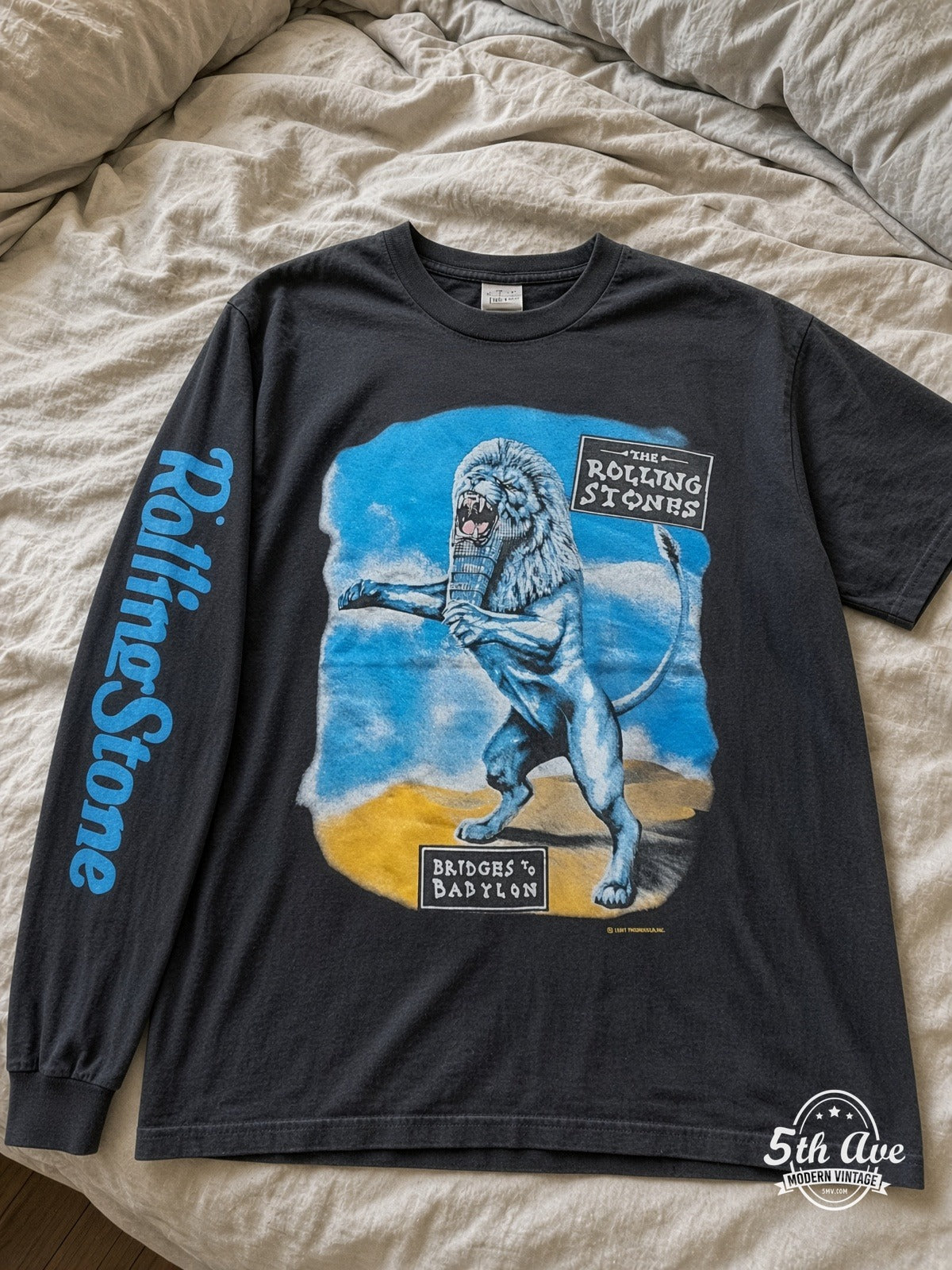 ETS LS 07 The Rolling Stones Bridges to Babylon Lion long sleeve vintage tee laid on a bed