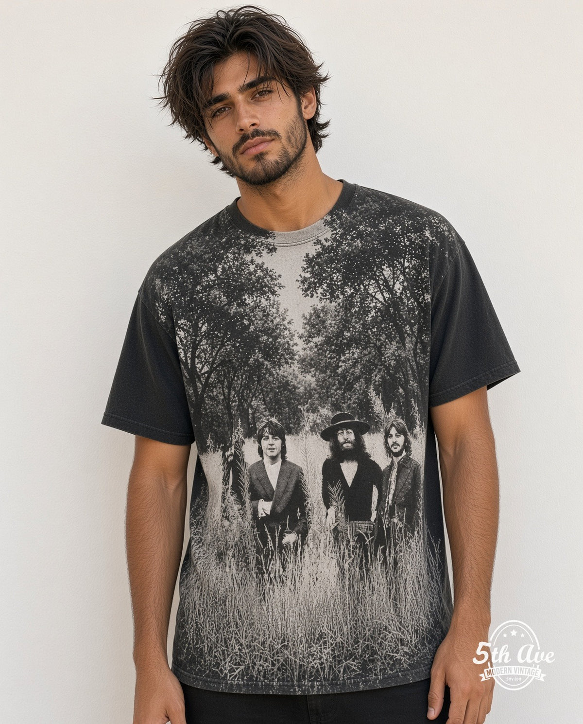 Model wearing The Beatles Field of Grass 1995 all-over-print vintage band t-shirt in black
