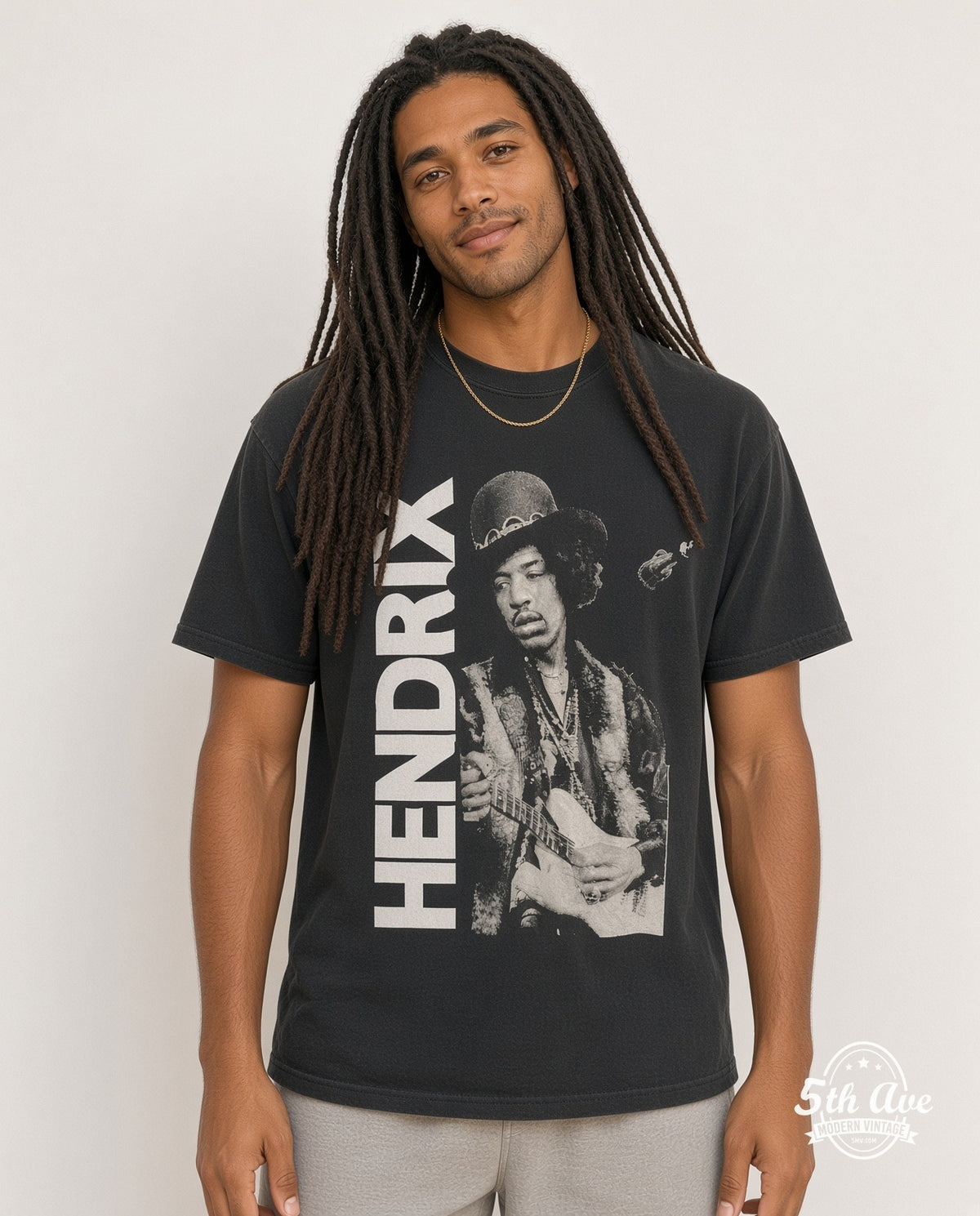 Model wearing the Jimi Hendrix Hat Guitar Portrait Vertical Name vintage band t-shirt