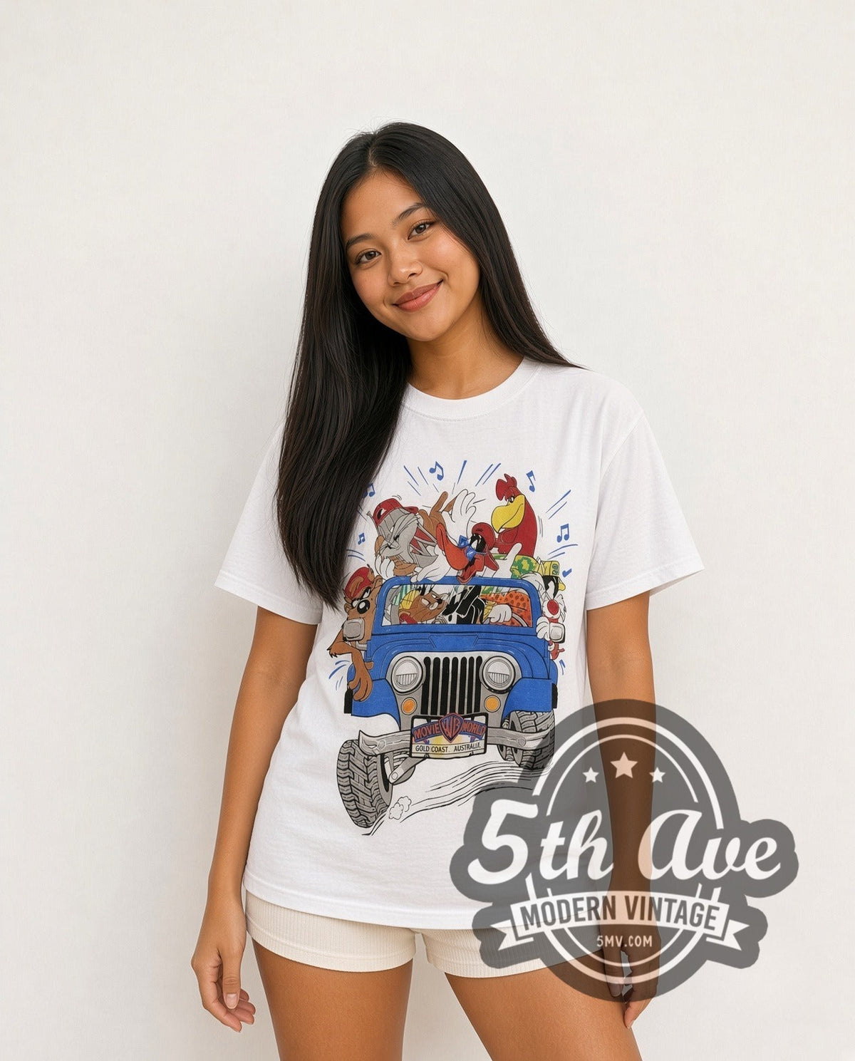 Model wearing the Looney Tunes Warner Brothers Gold Coast vintage graphic t-shirt