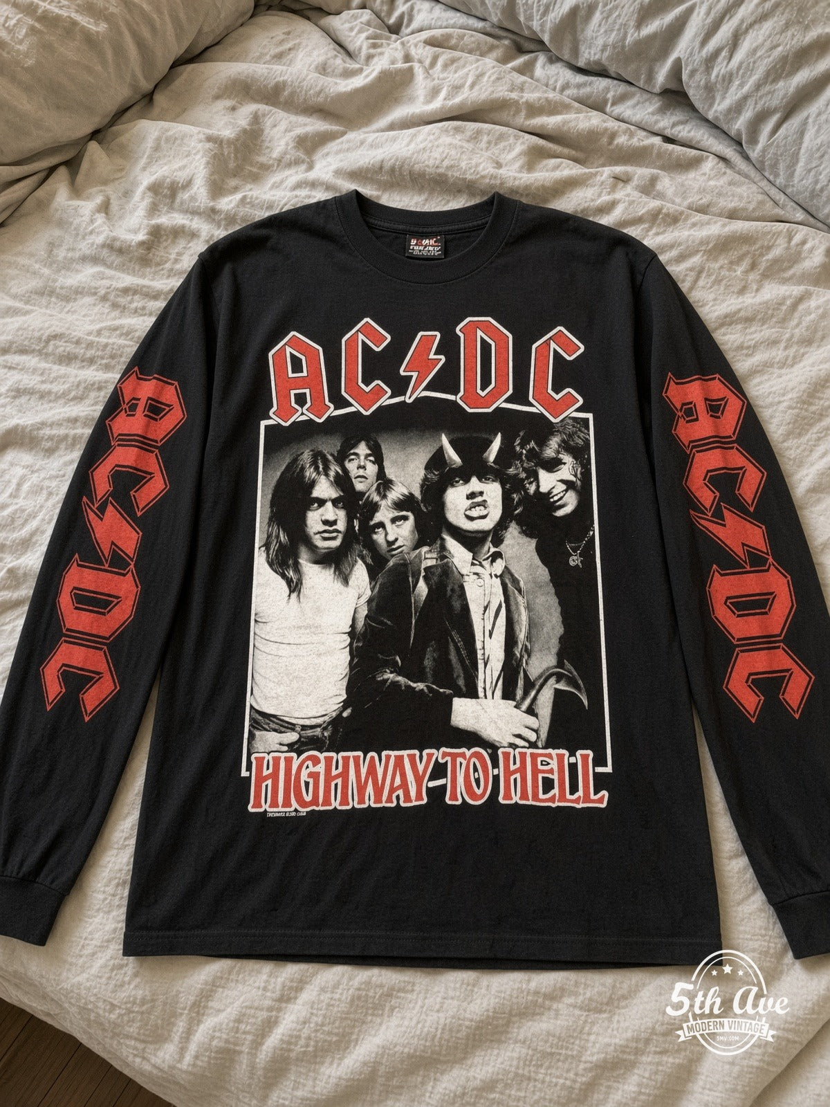 ETS LS 13 AC/DC Highway to Hell Band Photo long sleeve vintage tee laid on a bed