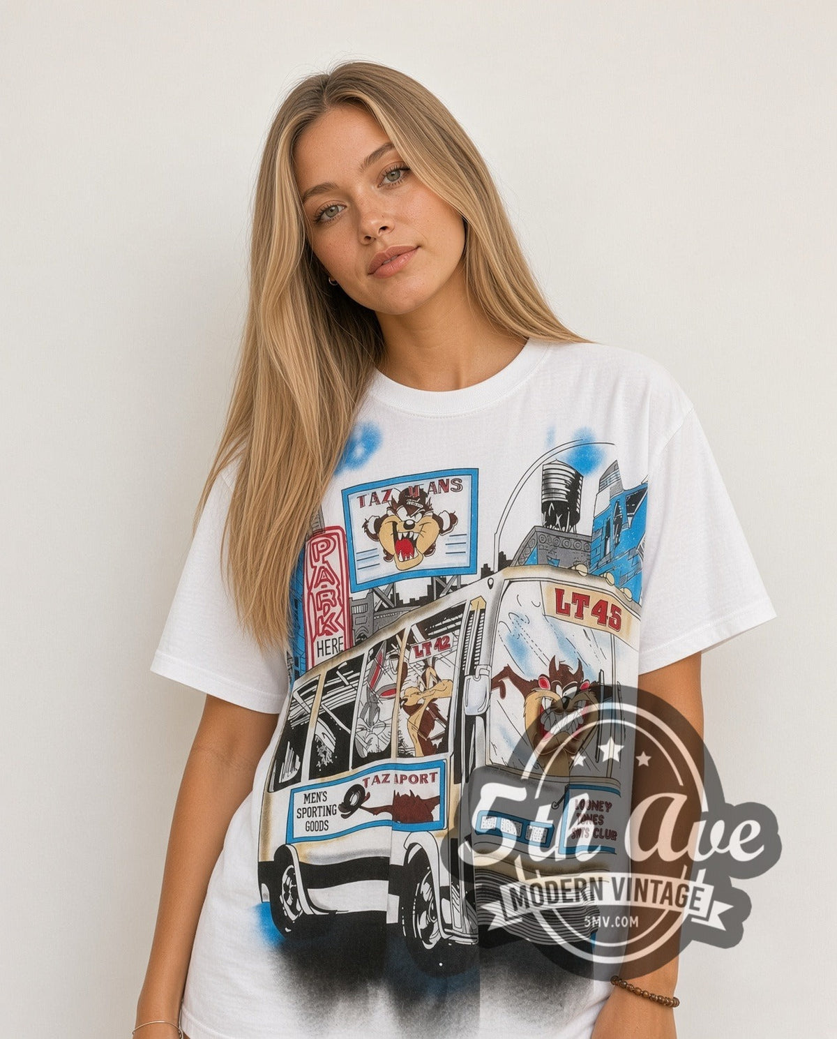 Model wearing the Looney Tunes On the Move all-over-print vintage cartoon tee