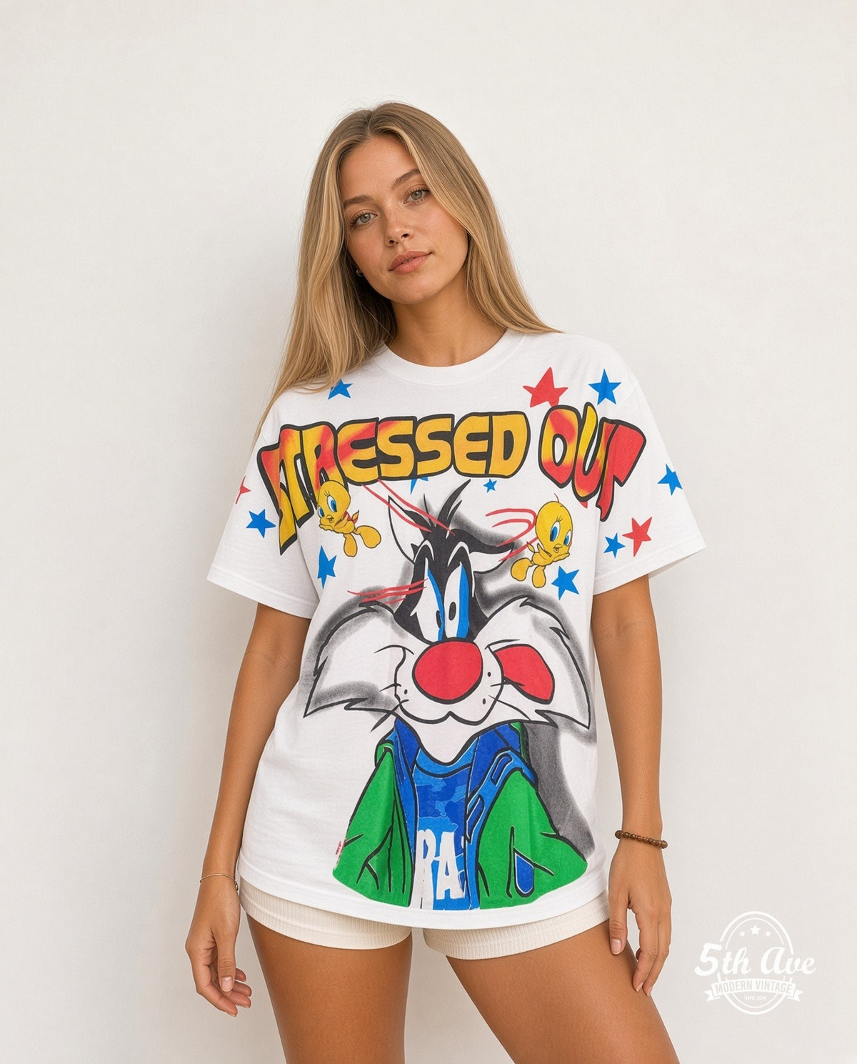 Model wearing the Looney Tunes Sylvester and Tweety Stressed Out all-over-print graphic tee