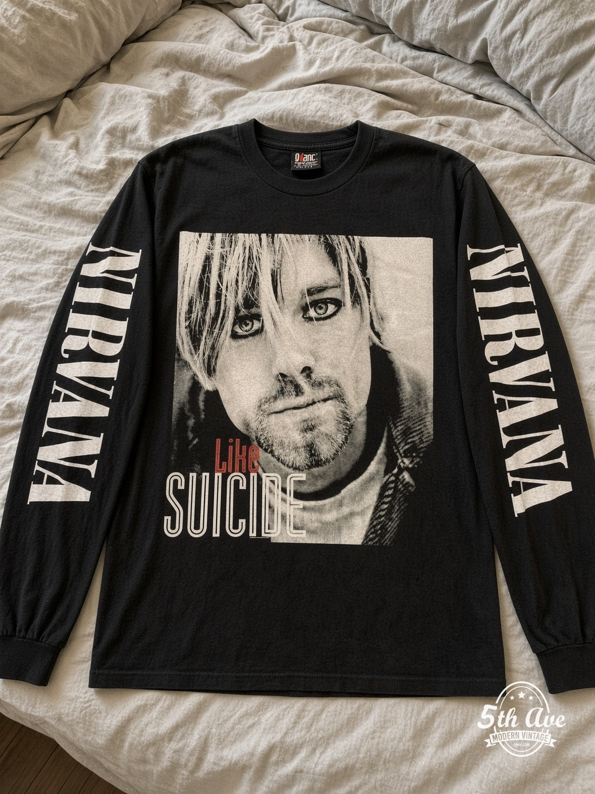 ETS LS 14 Nirvana Like Suicide Portrait long sleeve vintage tee laid on a bed