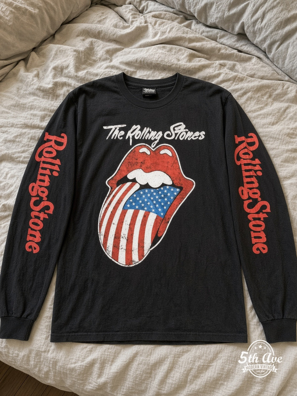 ETS LS 15 The Rolling Stones US Flag Tongue long sleeve vintage tee laid on a bed