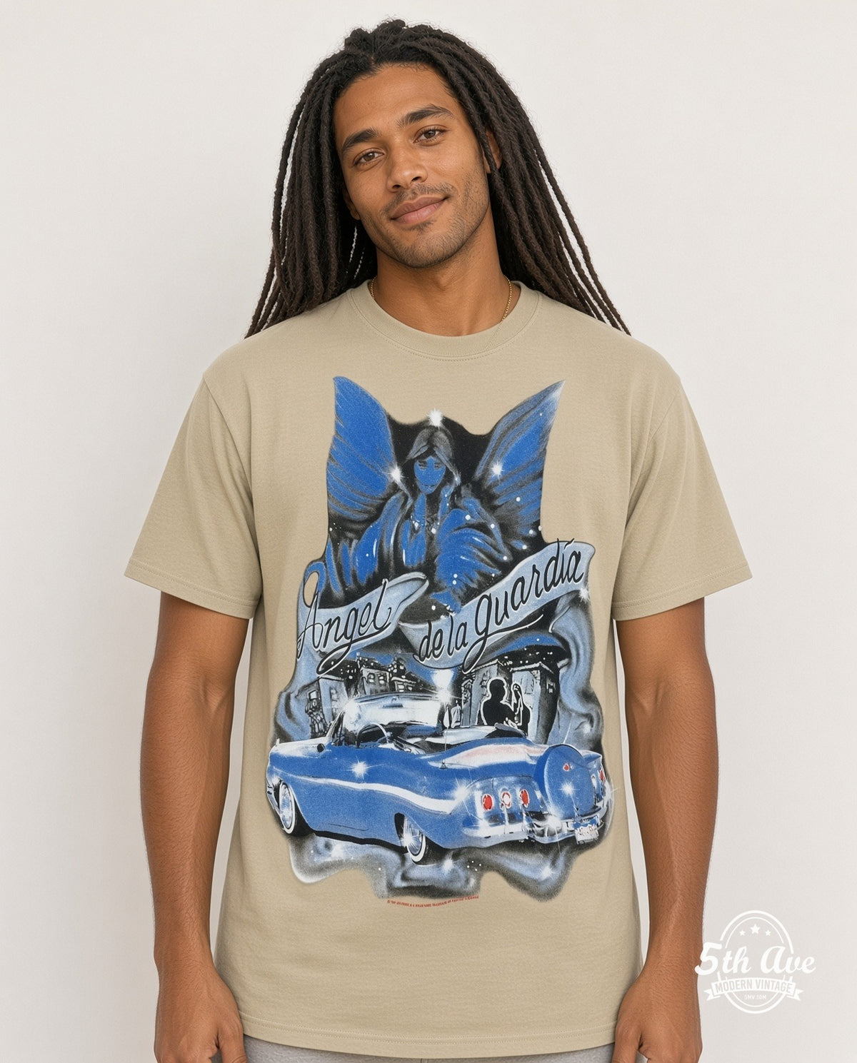 Model wearing the Rollin Hard Angel de la Guardia Lowrider graphic tee in sand (photo 4)