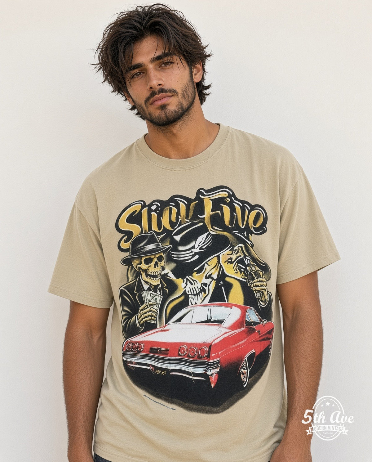 Model wearing the Rollin Hard Slick Five Lowrider graphic tee in sand