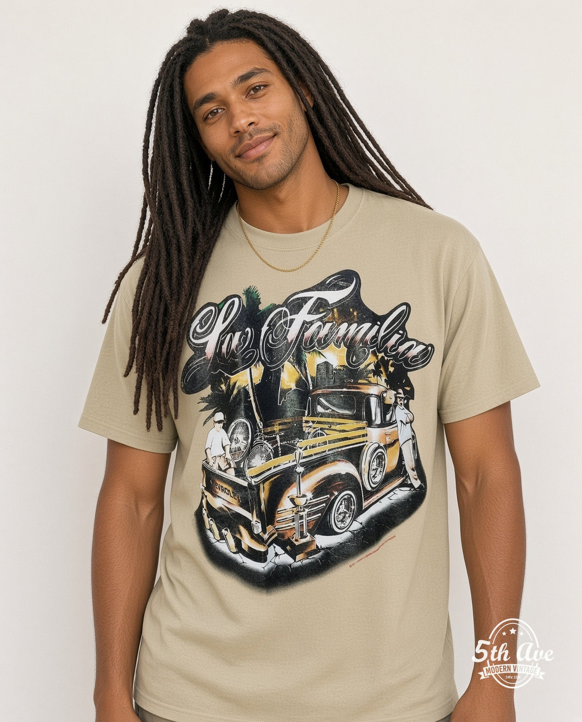 Model wearing the Rollin Hard For Familia Lowrider graphic tee in sand