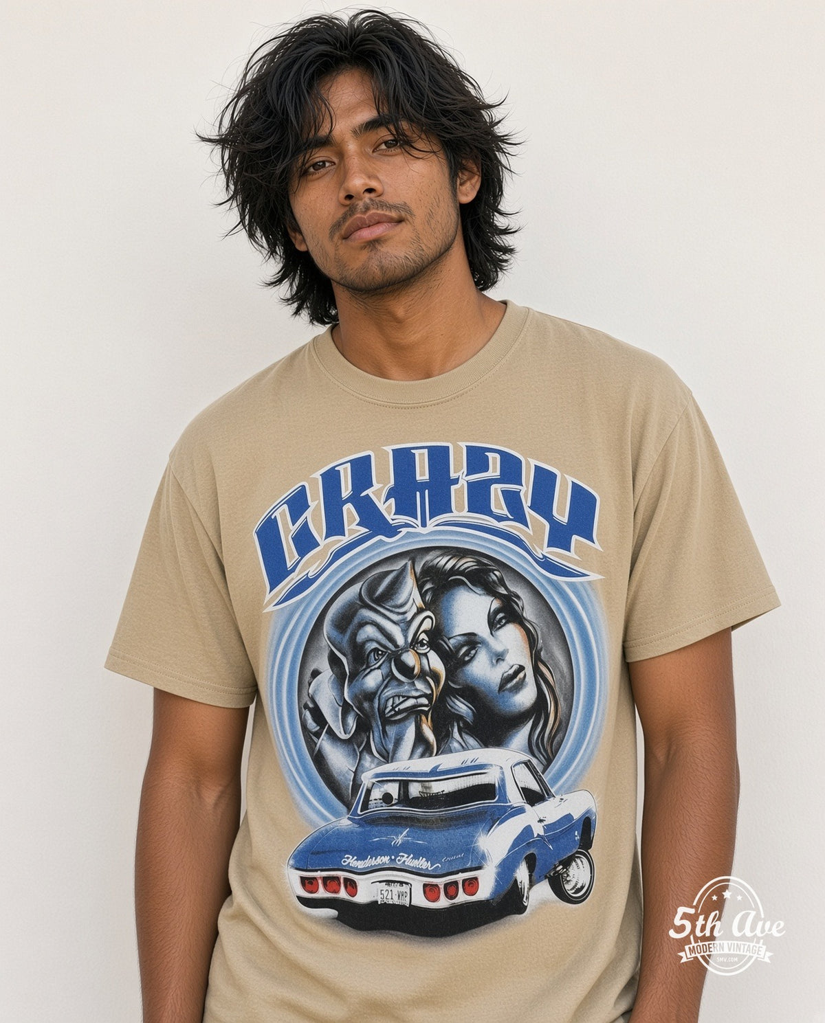 Model wearing the Rollin Hard Crazy Lowrider graphic tee in sand
