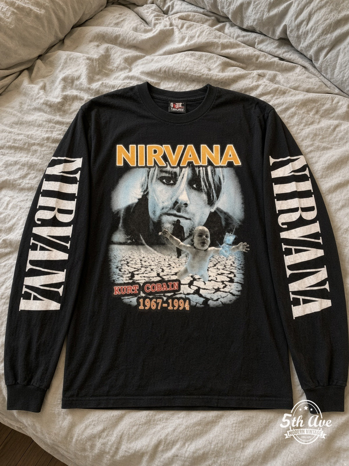 ETS LS 16 Nirvana Kurt Cobain 1967-1994 long sleeve vintage tee laid on a bed