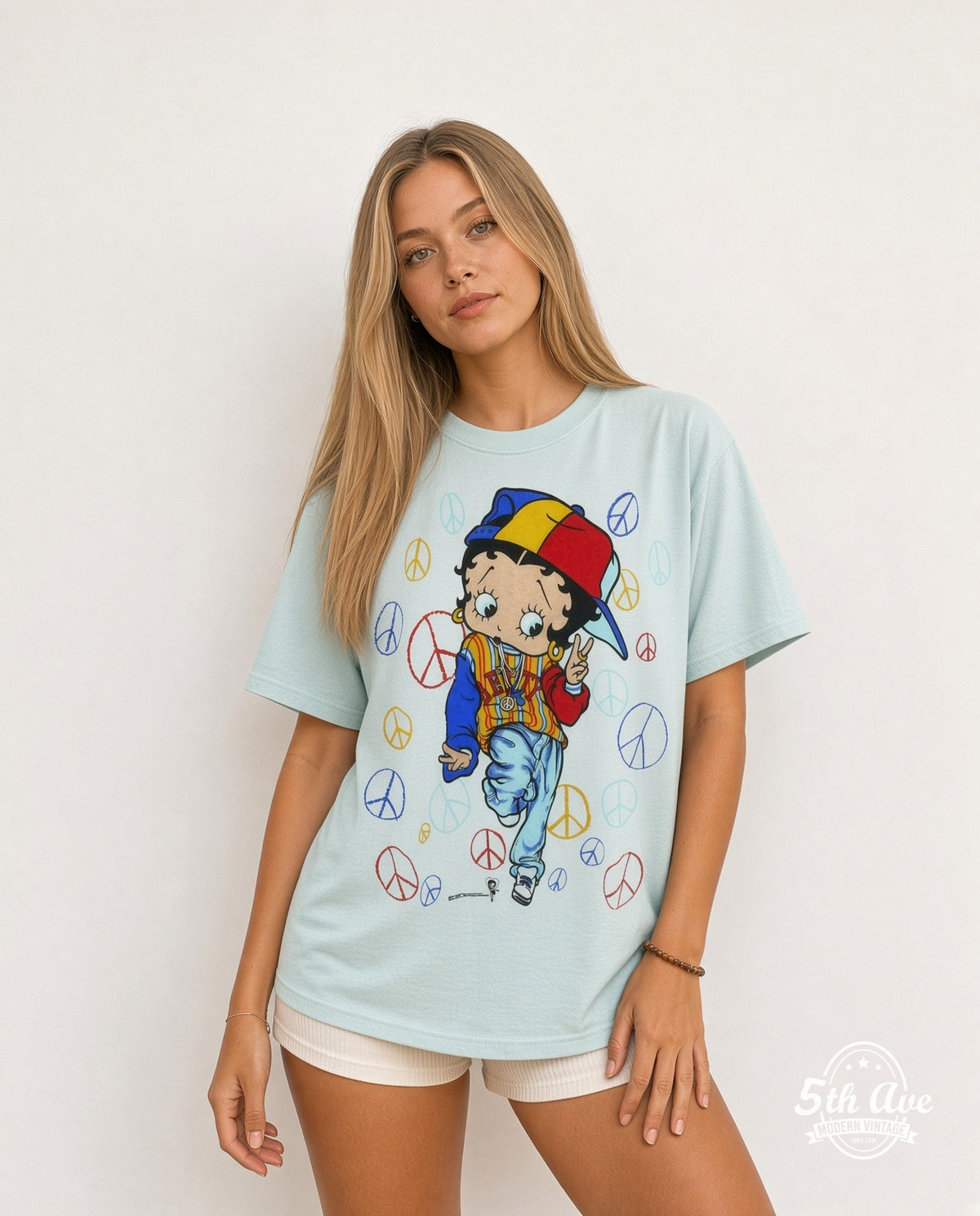 Model wearing the Betty Boop Peace all-over-print graphic tee