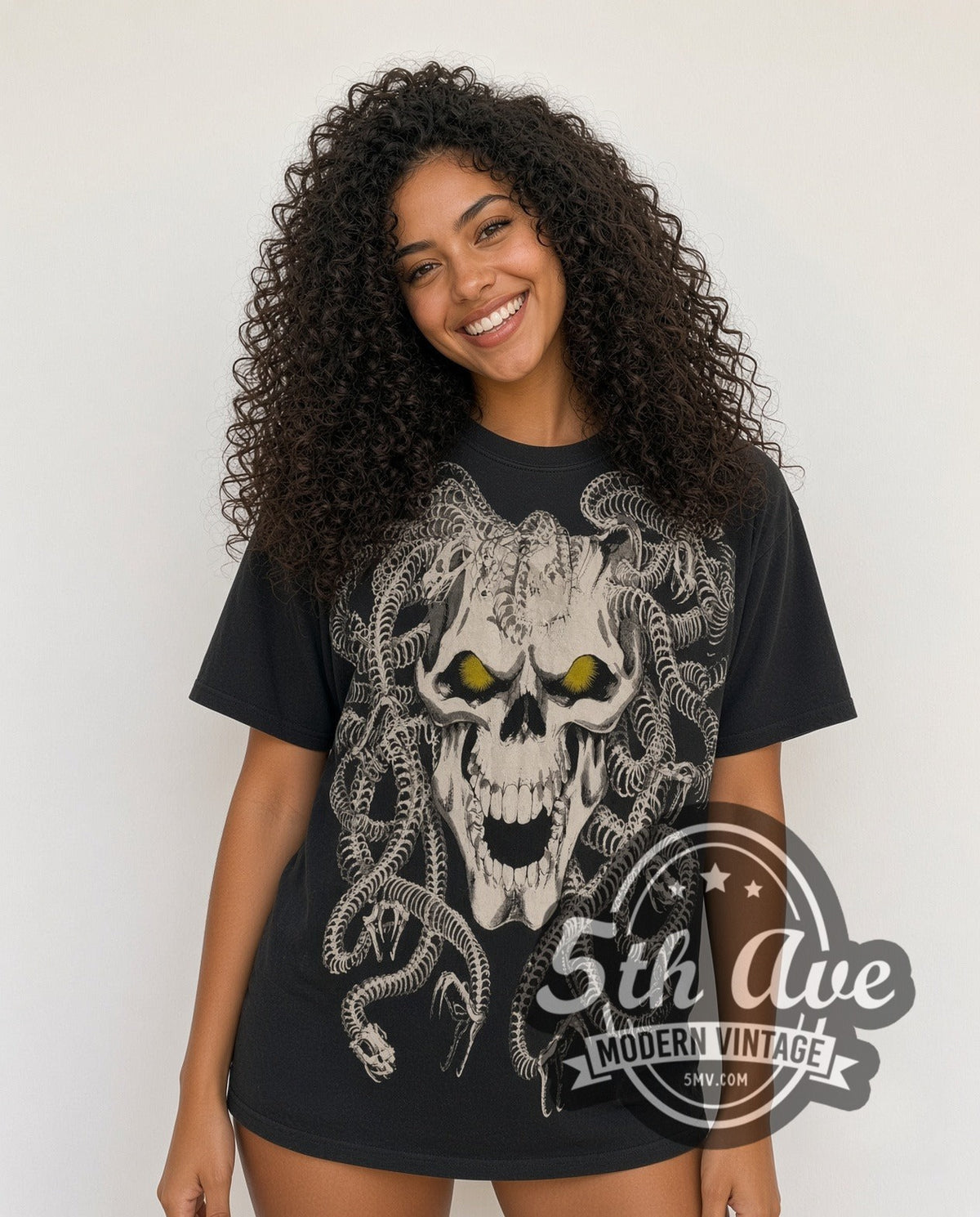 Model wearing the Medusa Skull all-over-print vintage graphic tee