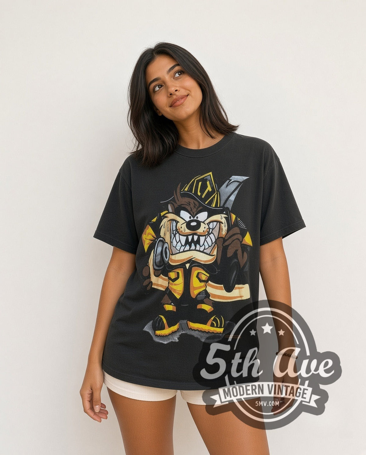 Model wearing the Looney Tunes Taz-Mania Fire Department all-over-print vintage cartoon tee
