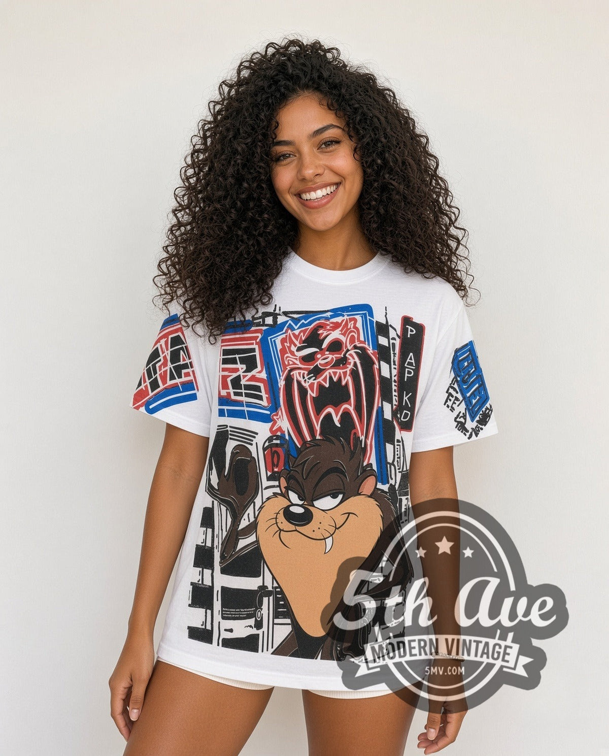 Model wearing the Looney Tunes Taz-Mania Graphic Art all-over-print vintage cartoon tee