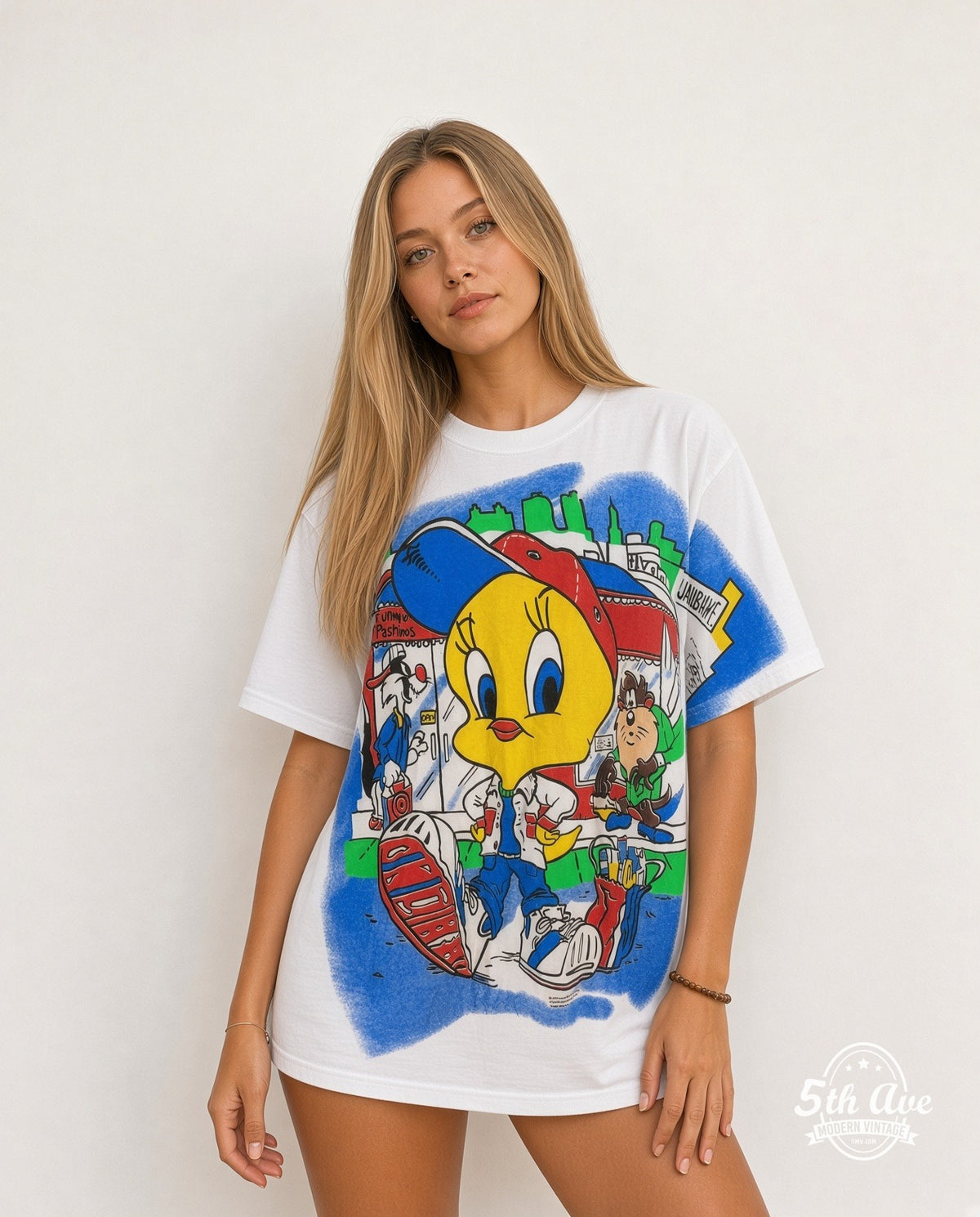 Model wearing the Looney Tunes Tweety, Taz and Sylvester all-over-print graphic tee