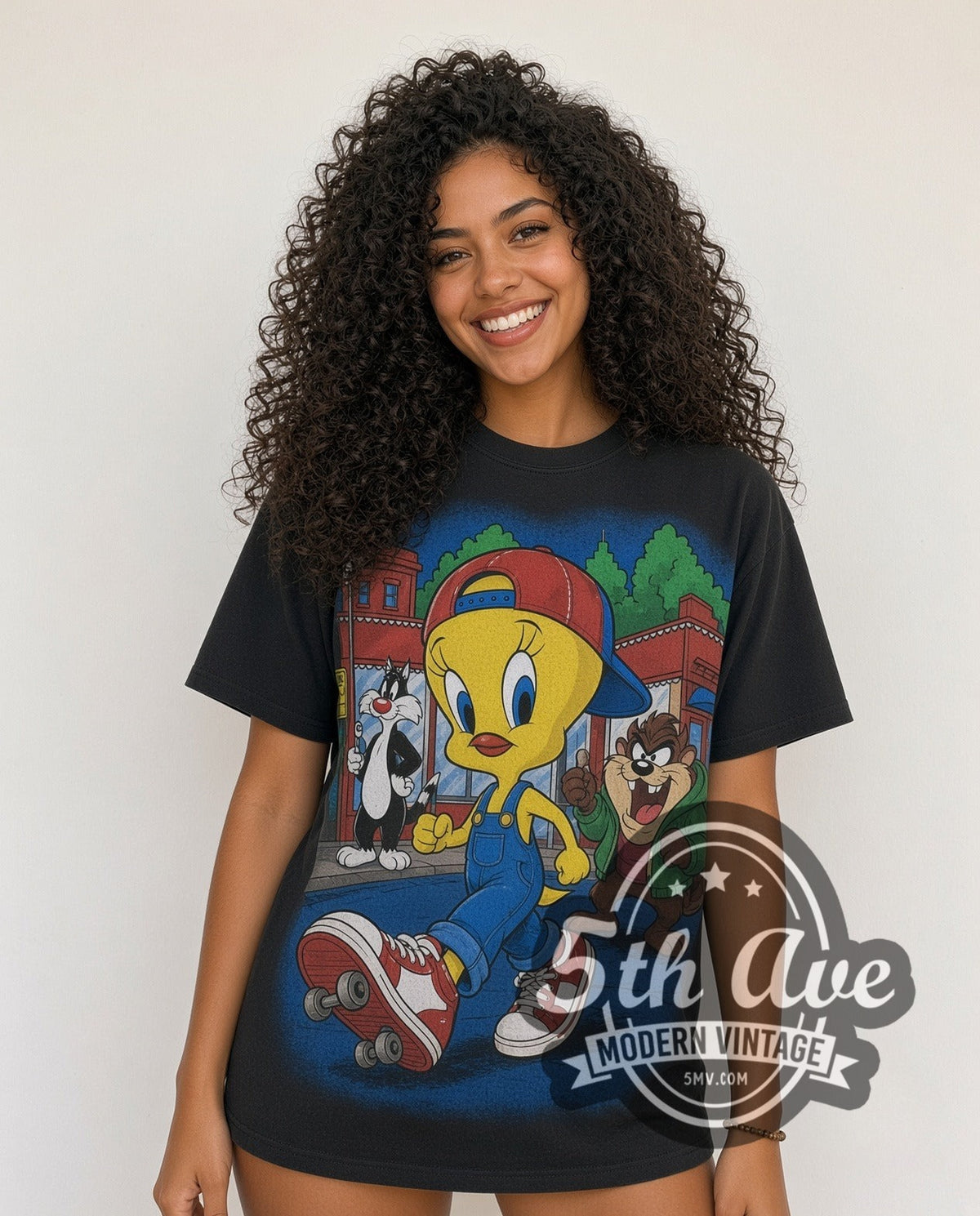 Model wearing the Looney Tunes Tweety, Sylvester and Taz-Mania all-over-print vintage cartoon tee