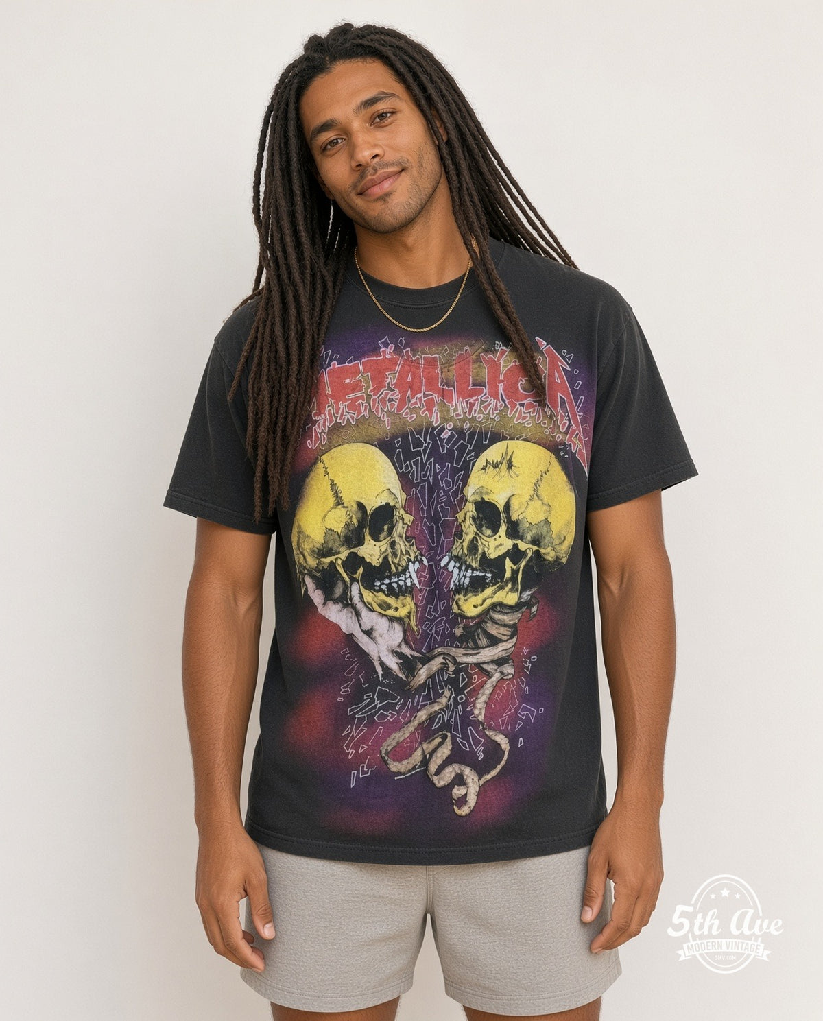Model wearing the Metallica Twin Skulls all-over-print vintage band t-shirt