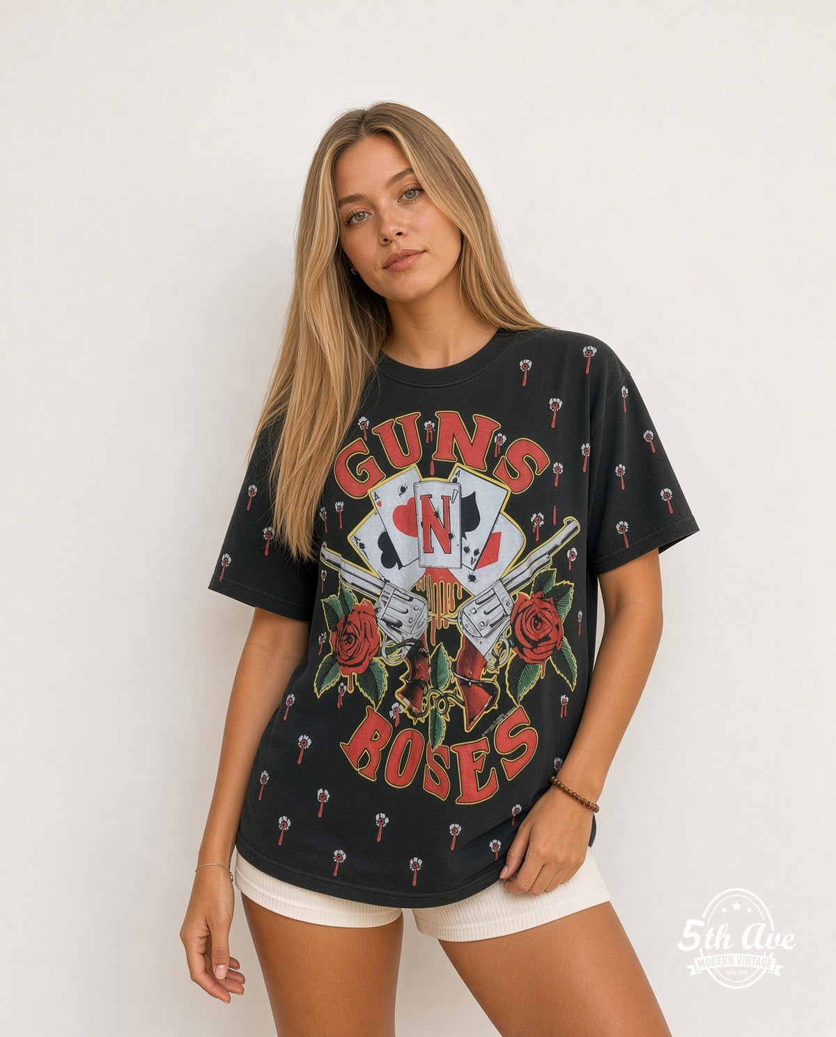 Model wearing the Guns N' Roses Crossed Guns Roses Aces all-over-print vintage band t-shirt