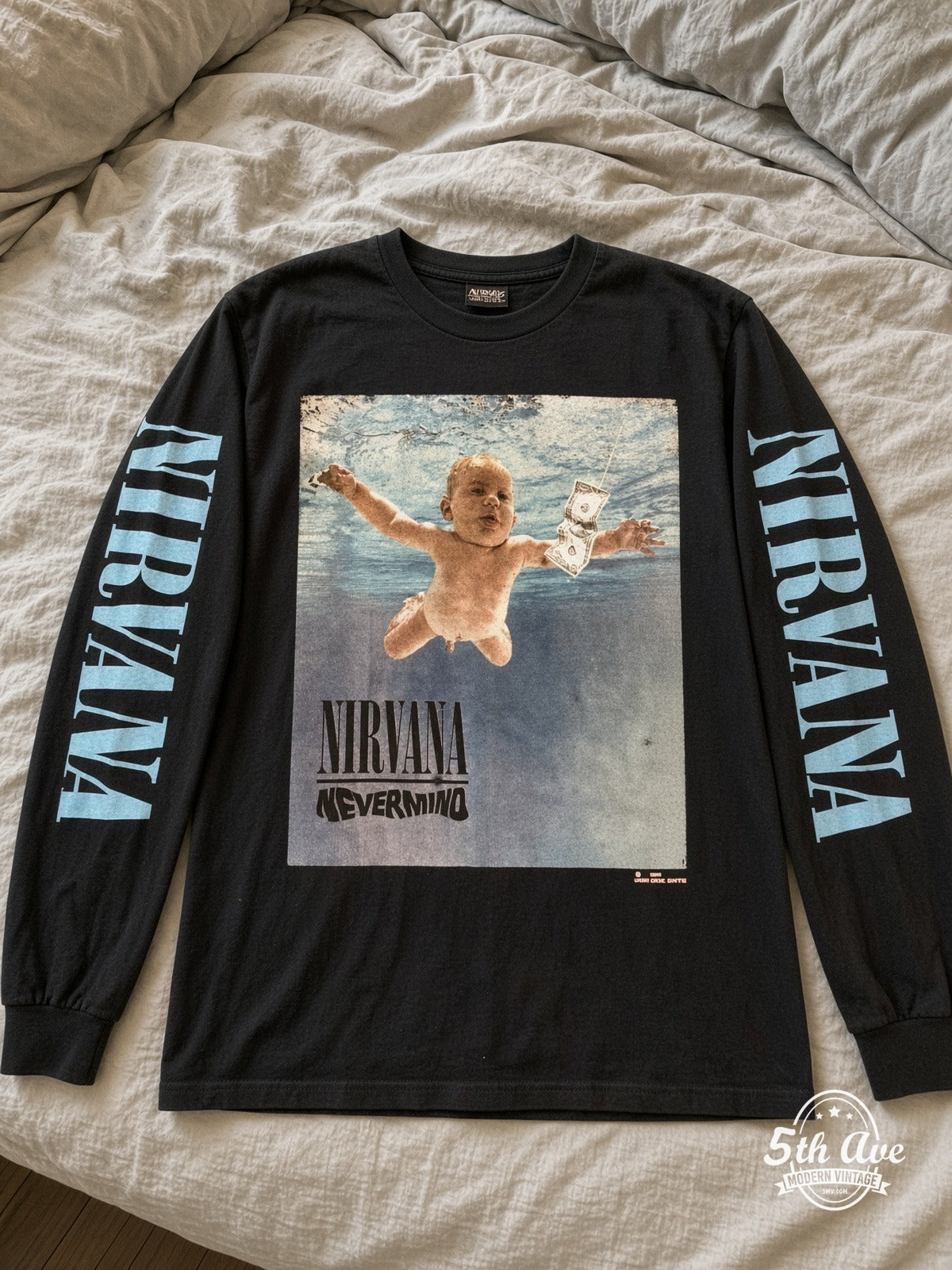 ETS LS 17 Nirvana Nevermind long sleeve vintage tee laid on a bed