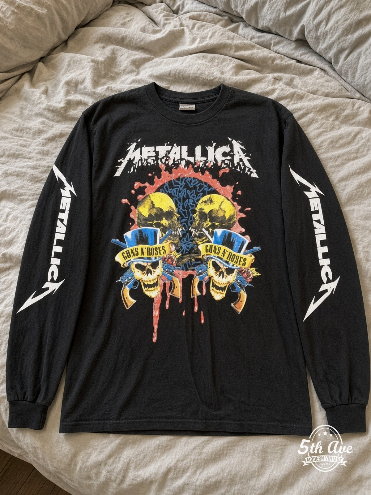 ETS LS 19 Metallica Guns N' Roses Skulls long sleeve vintage tee laid on a bed