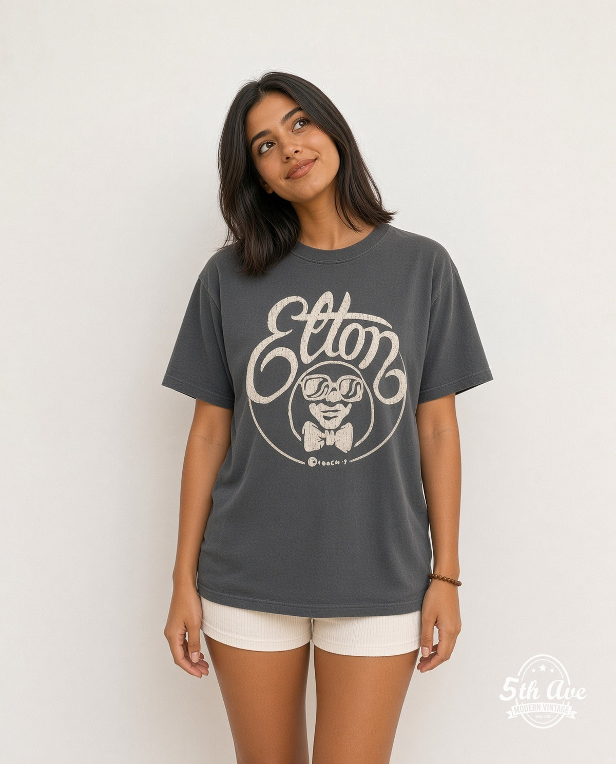 Model wearing the Elton John Elton Script Cartoon vintage band t-shirt
