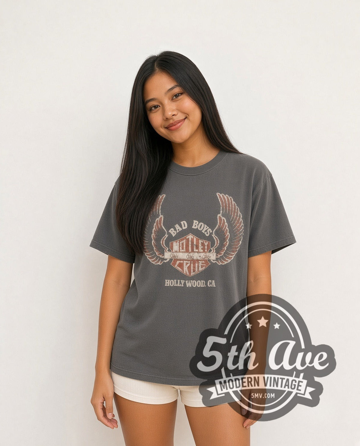 Model wearing the Mötley Crüe Bad Boys Girls Girls Girls Winged Shield vintage band t-shirt