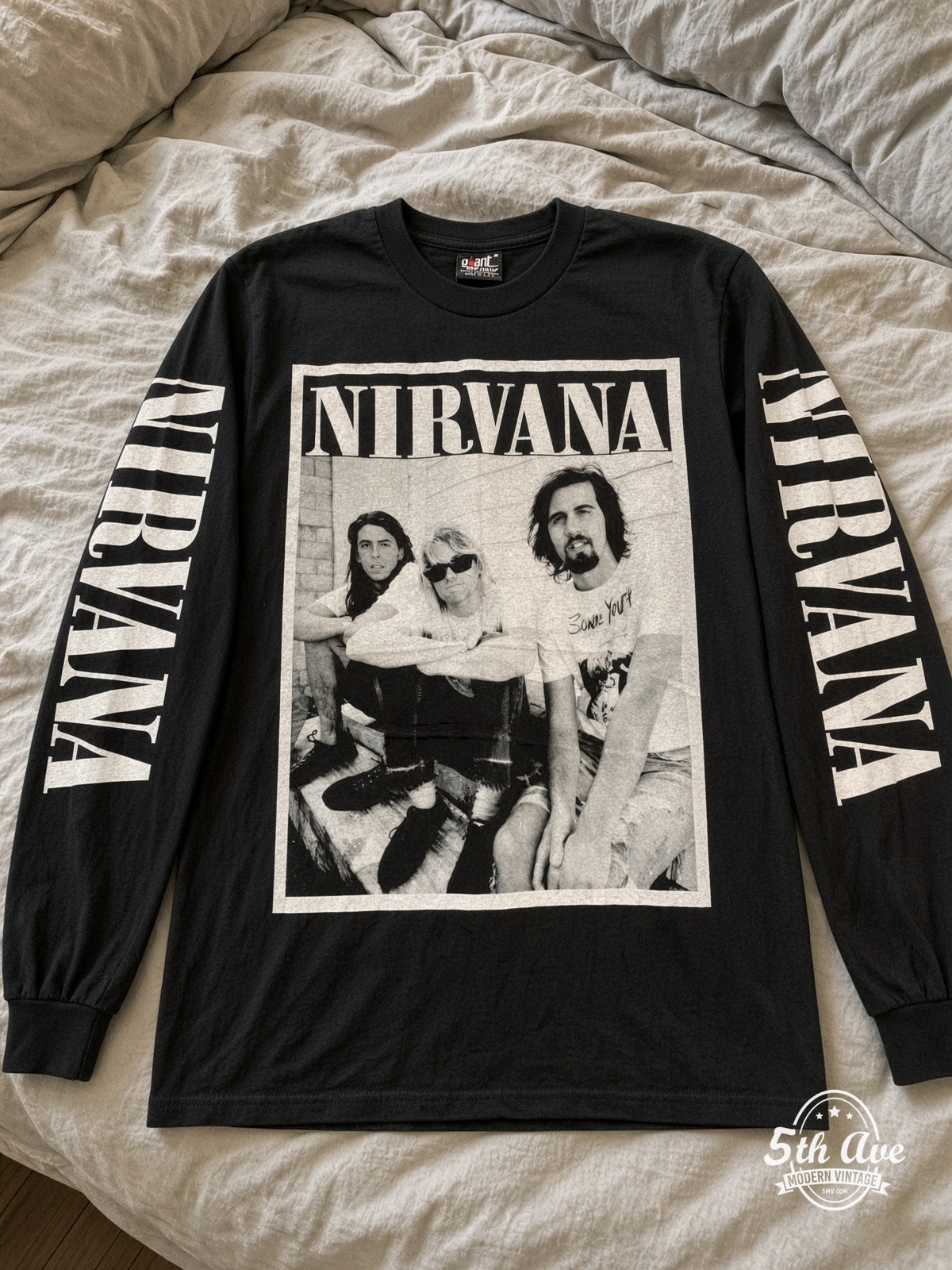 ETS LS 21 Nirvana Band Photo long sleeve vintage tee laid on a bed