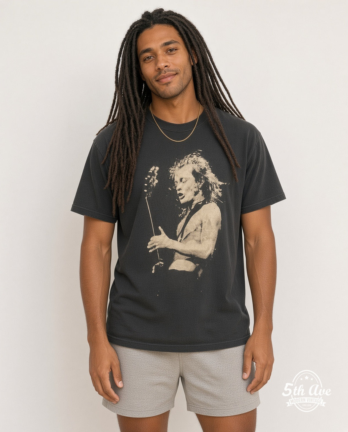 Model wearing the AC/DC Angus Young Shirtless Guitar Portrait vintage band t-shirt